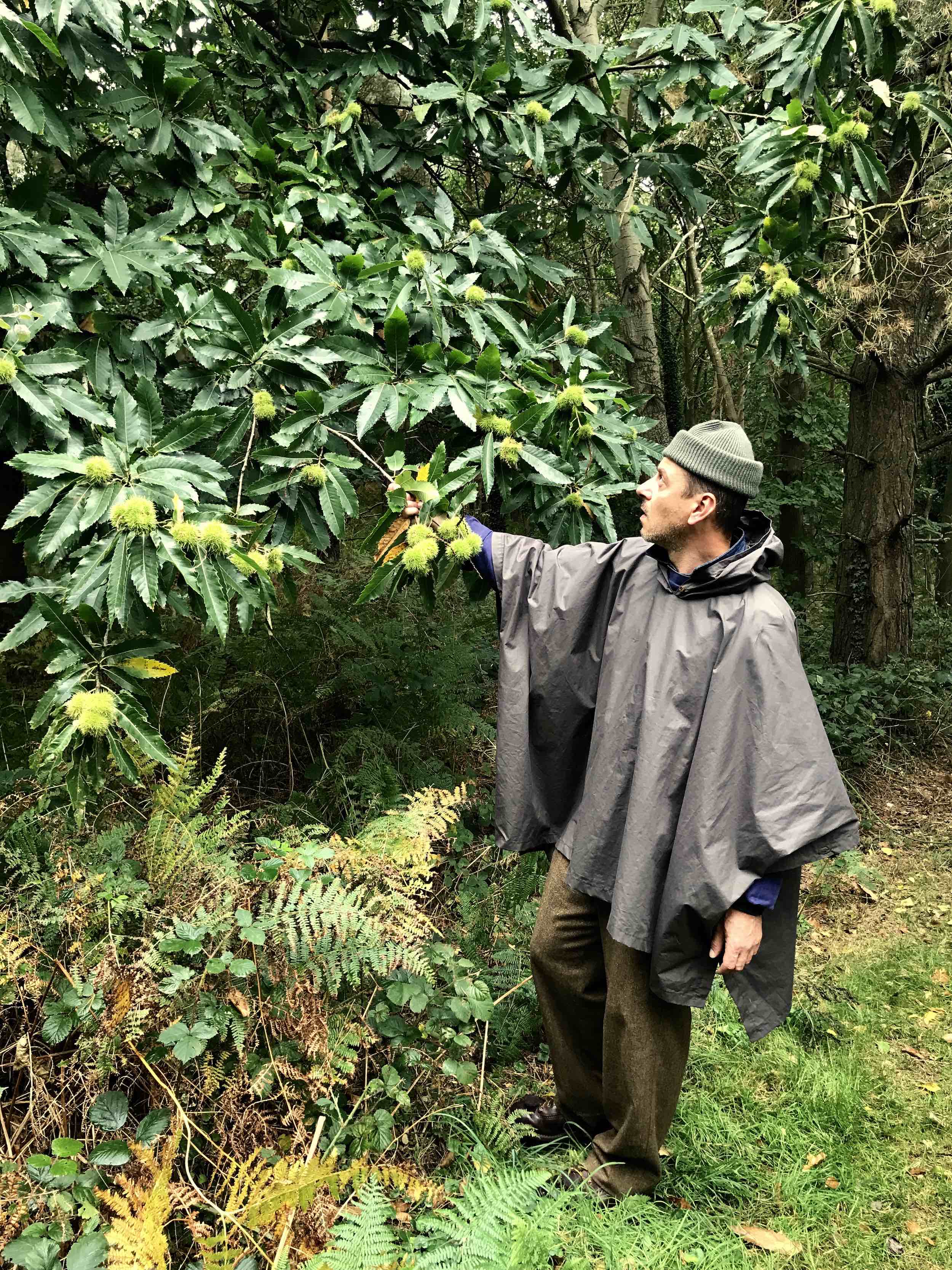 Man wears Carrier Company Wool Hat in Olive Drab with Rain Cape