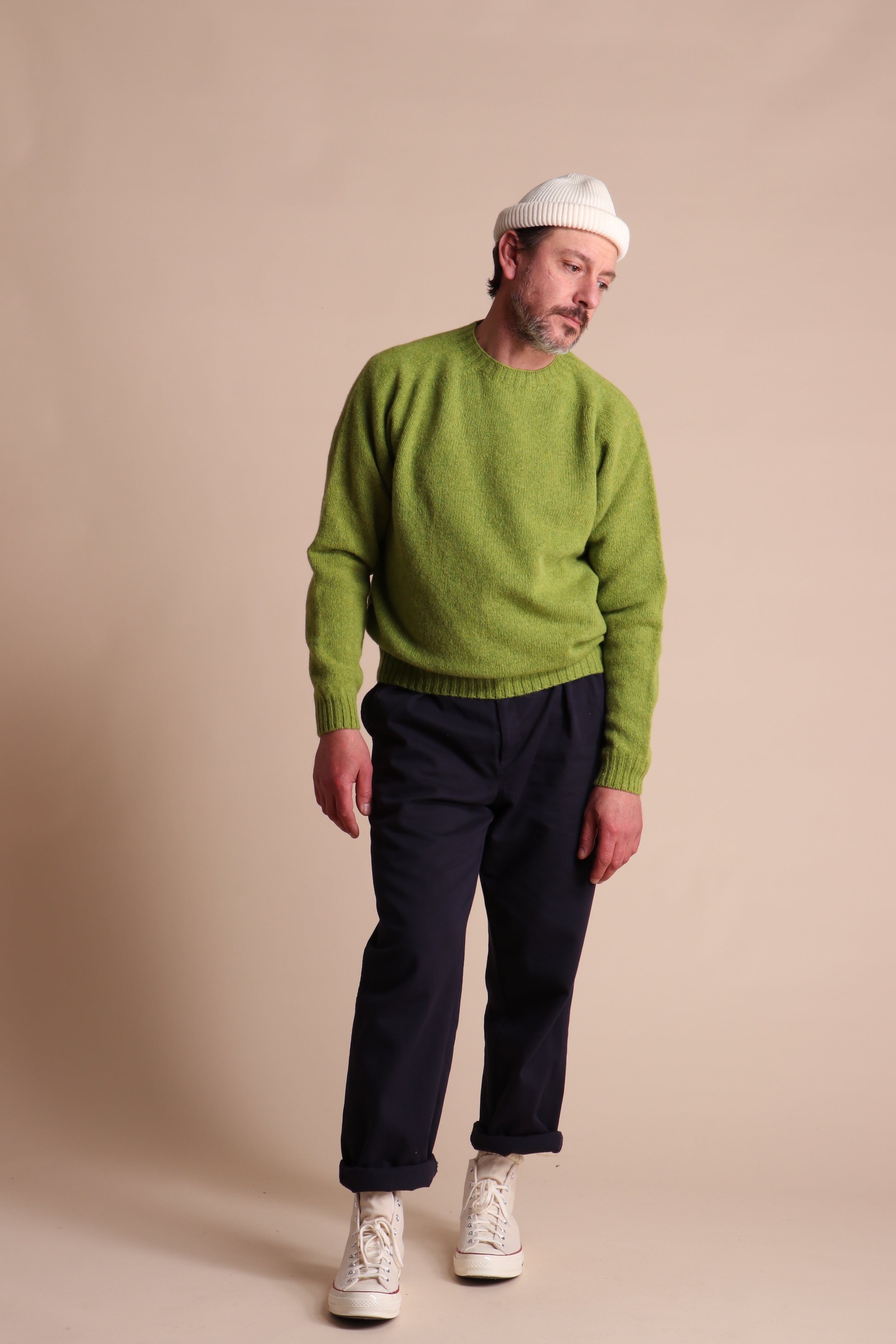 Man wearing Carrier Company Shetland Lambswool Jumper in Lime and Classic Trouser