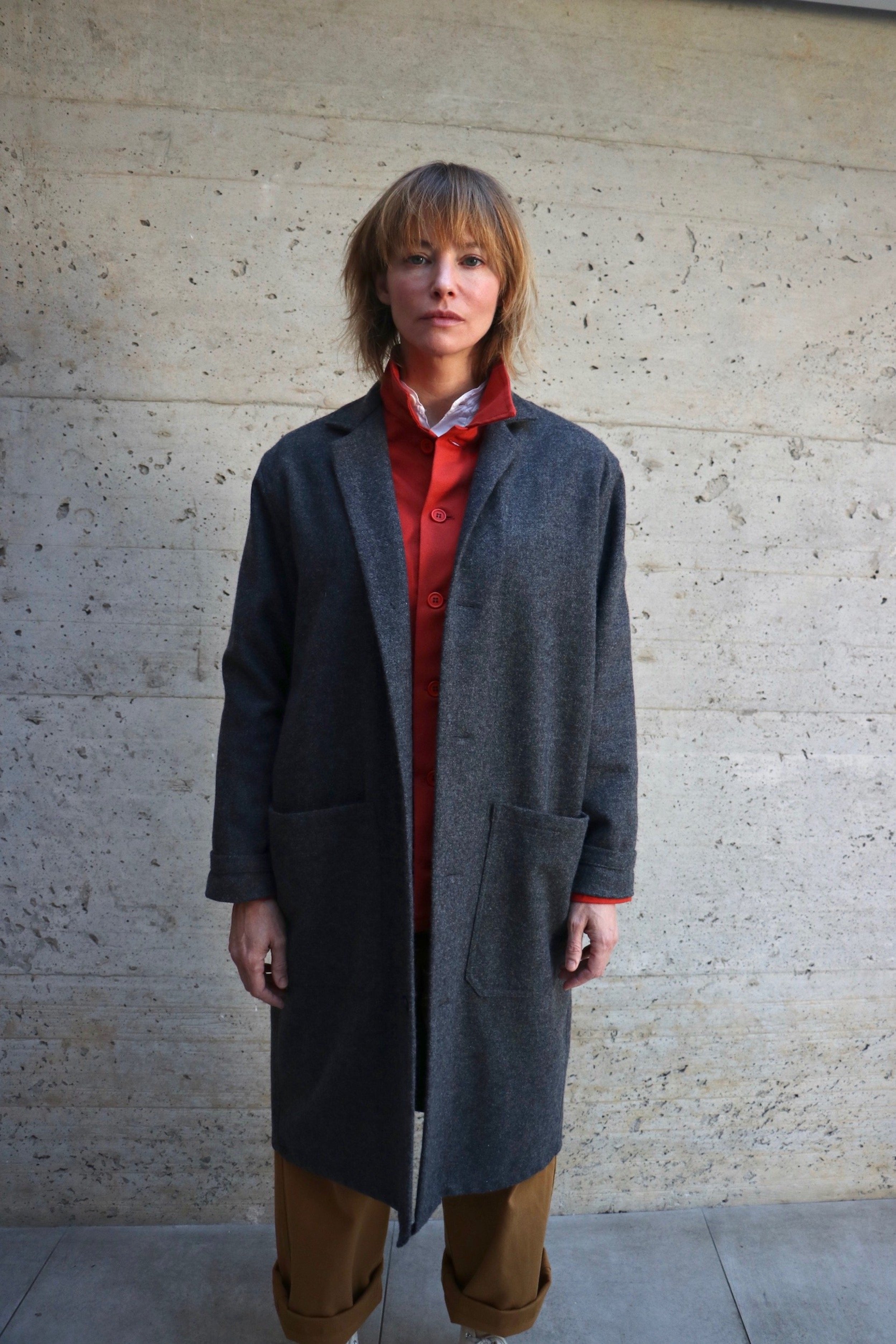 Woman wearing Carrier Company Wool Coat in Grey with Orange Work Jacket