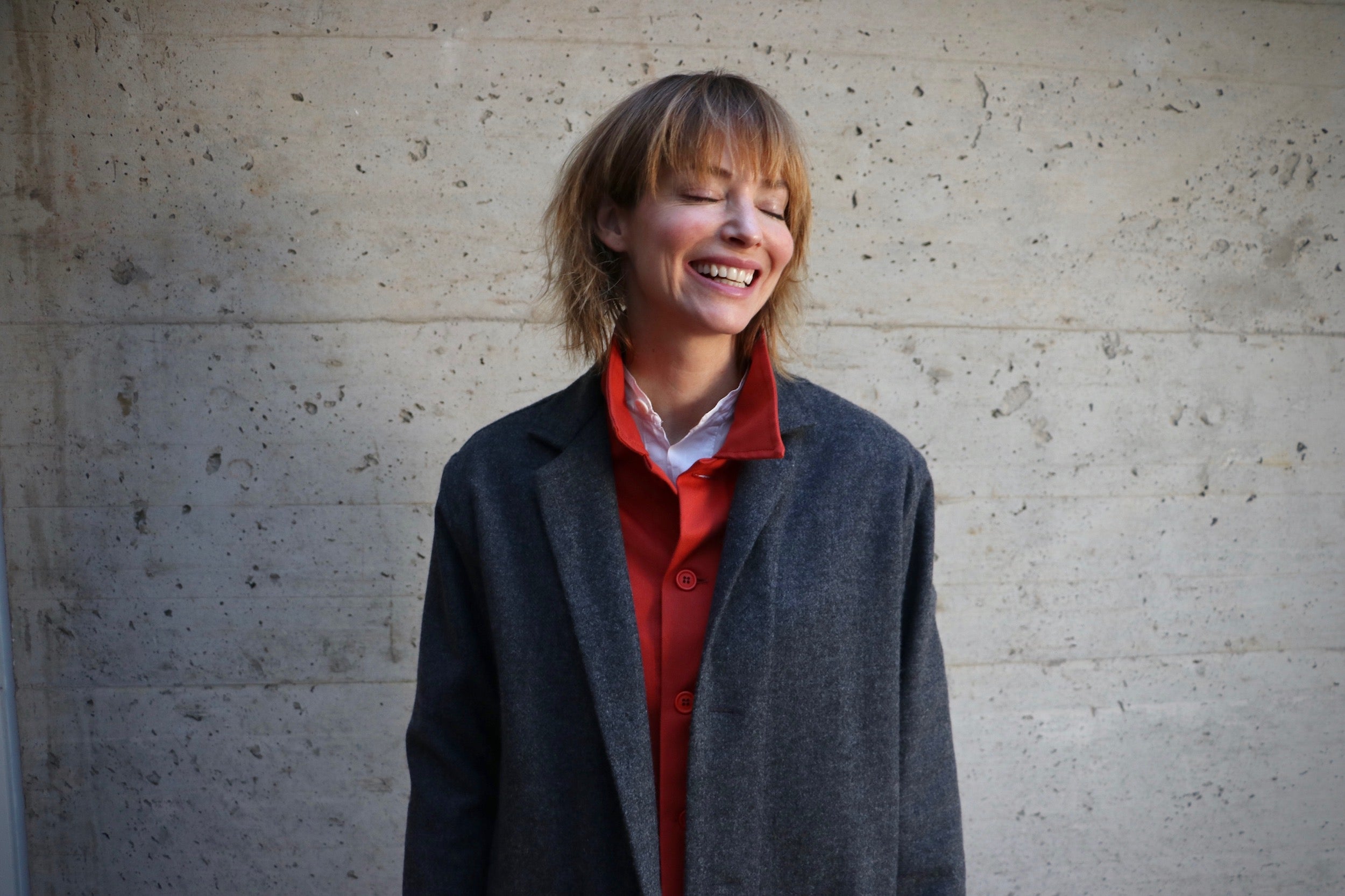 Woman wearing Carrier Company Wool Coat in Grey with Orange Work Jacket