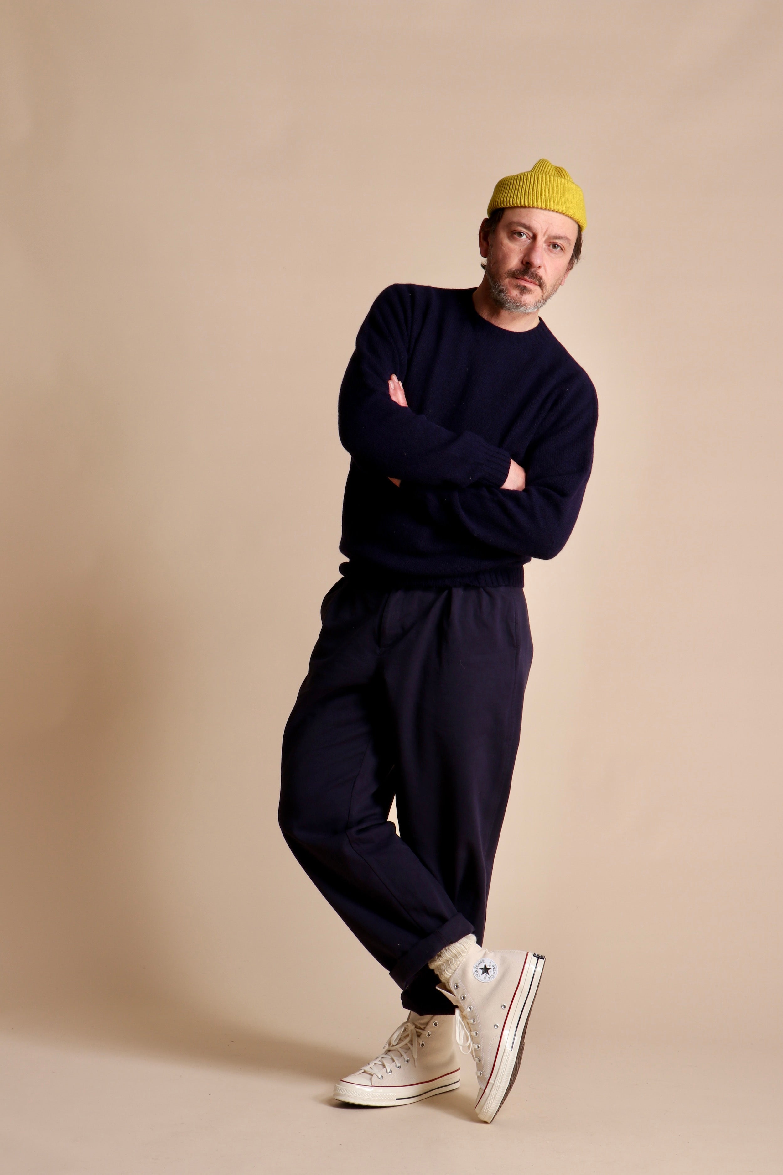 Man wearing Carrier Company Wool Hat in Yellow with Shetland Lambswool Jumper and Classic Trouser