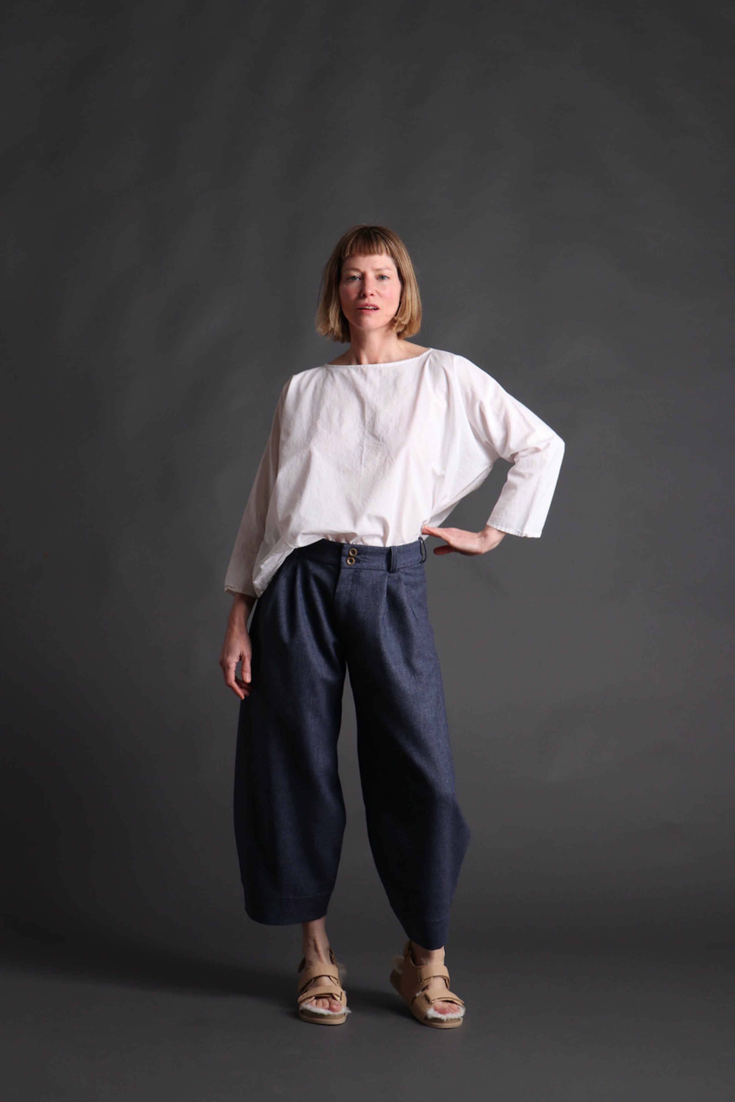 Woman wears Carrier Company White Cotton Tee Shirt with Dutch trouser Edit alt text