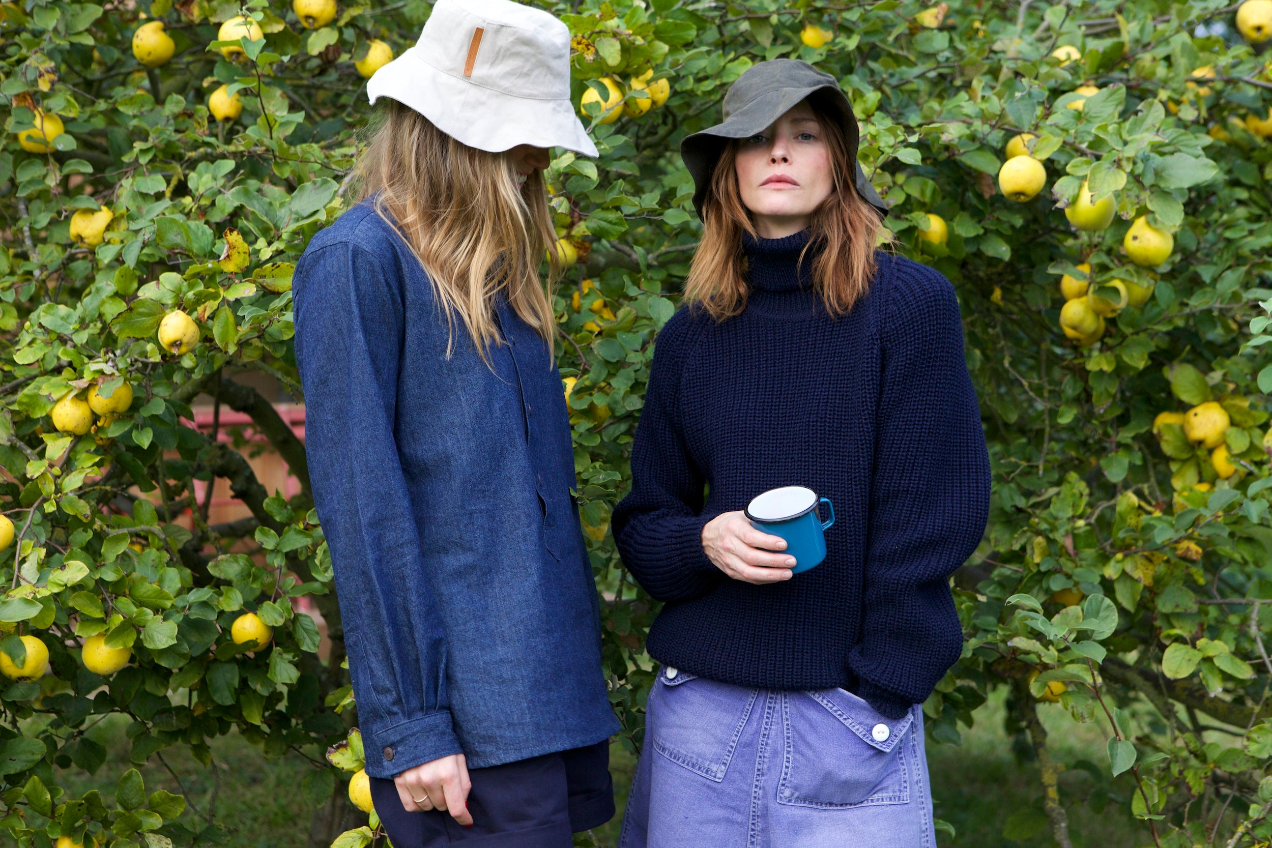 Woman wearing Carrier Company Fisherman's Jumper Mum Skirt and Sun Hat