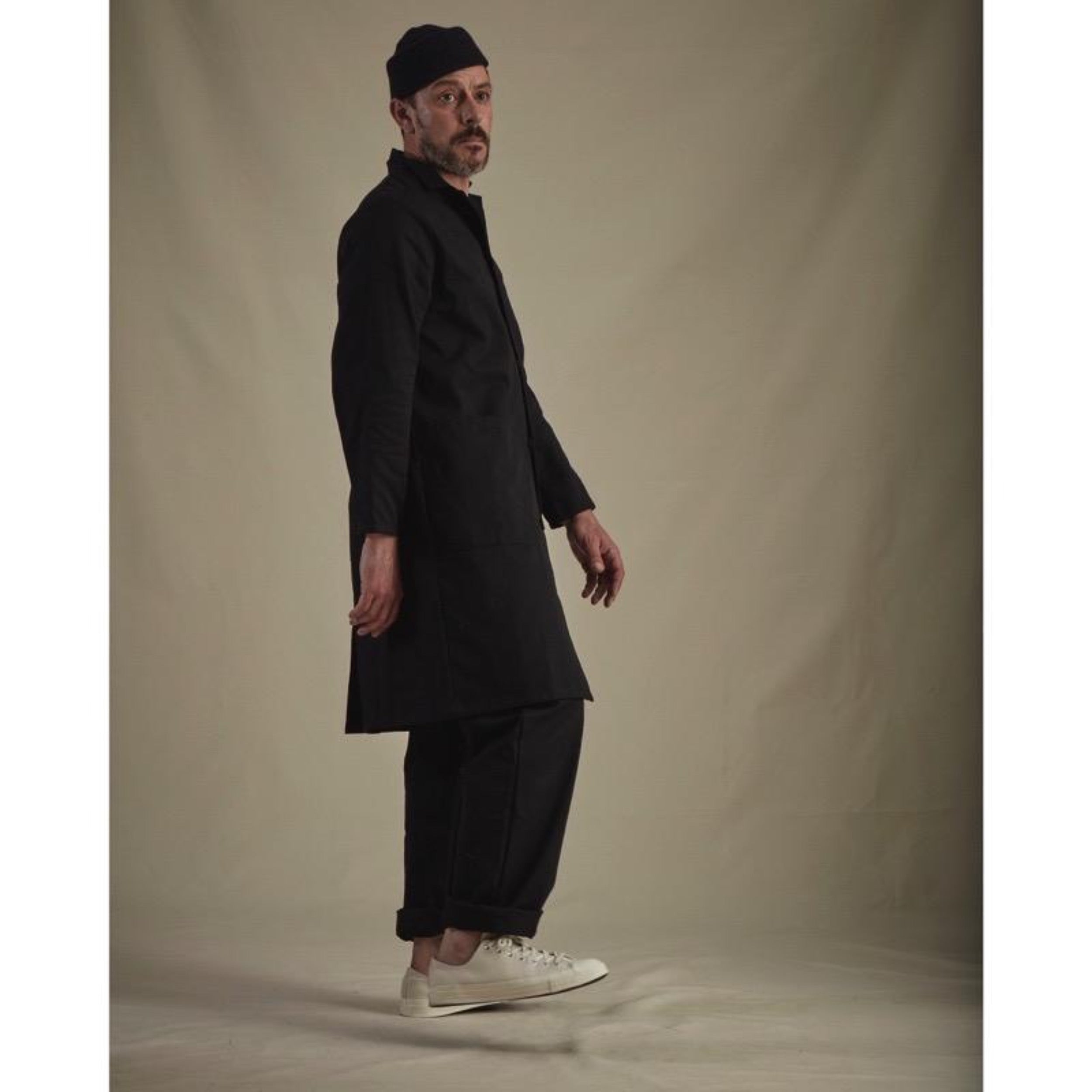 Man wearing Carrier Company Stockman's Coat in Black Drill and Black Men's Dungarees