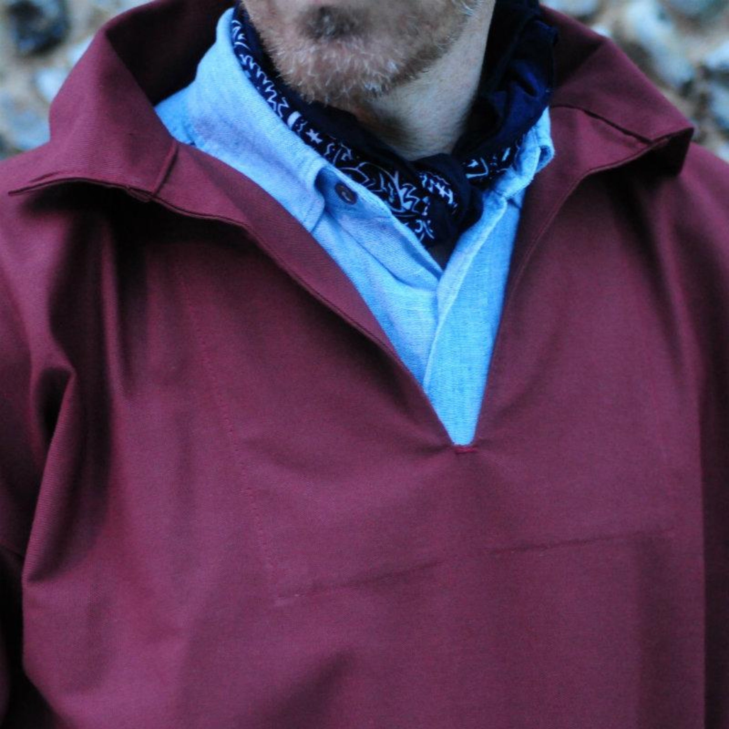 Man wearing Carrier Company V-Neck Smock in Breton Red