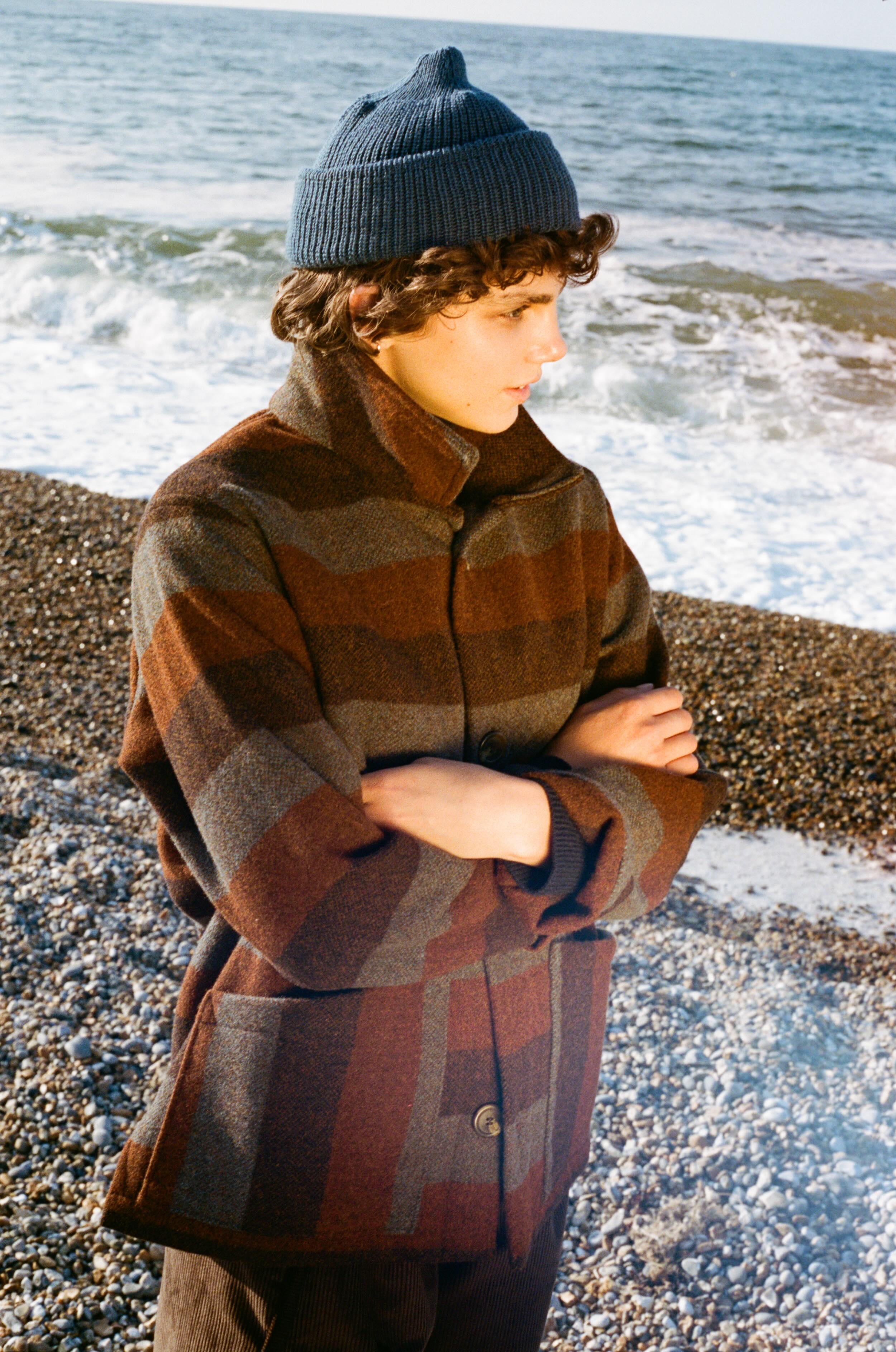 Els Wears Carrier Company Wool jacket in Conker Stripe With Superfino Merino Jumper, Dutch Trouser in Corduroy & Merino Watch Cap