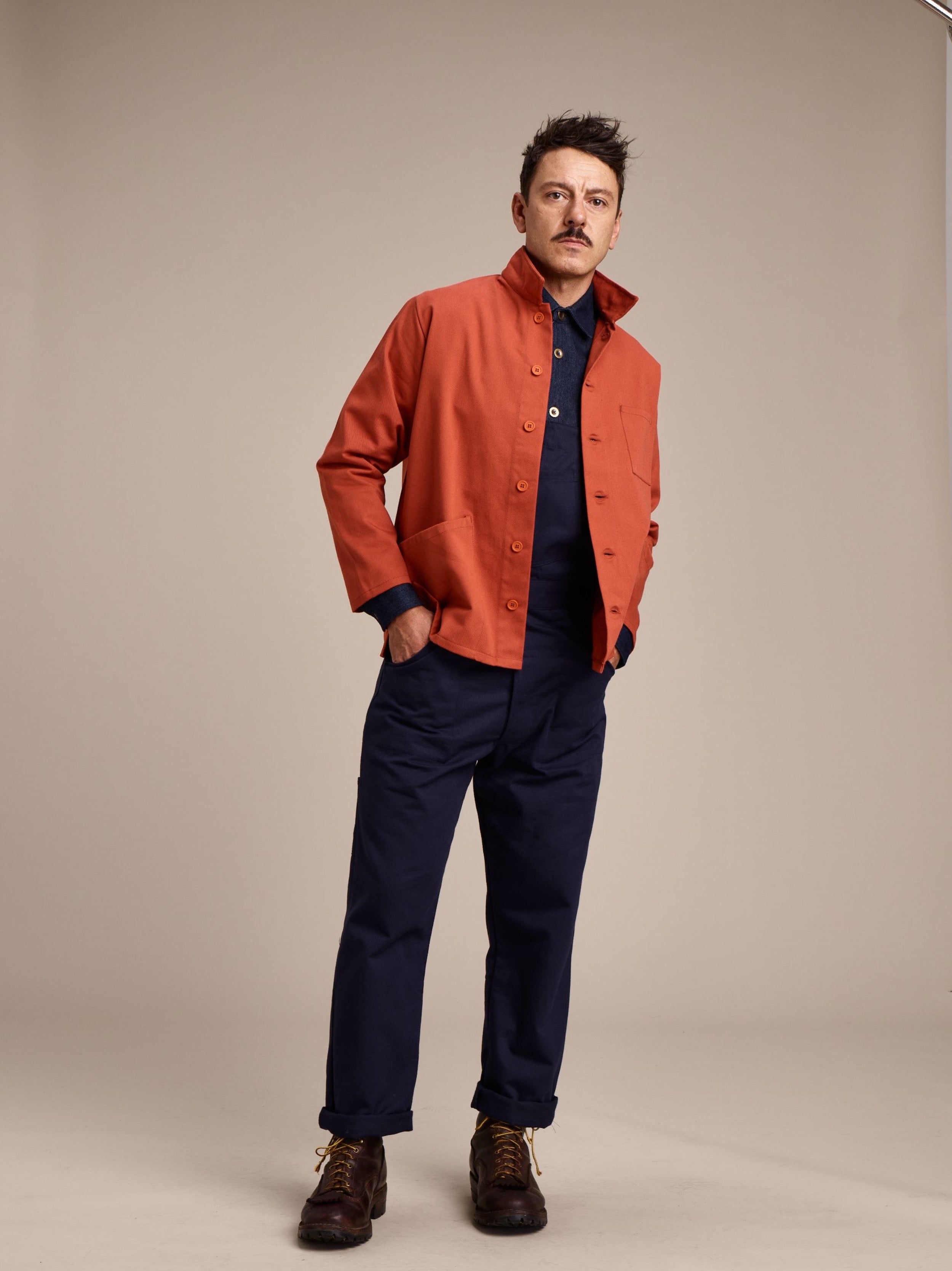 Man wearing  Carrier Company Men's Dungarees with Orange Work Jacket and Denim Collar Shirt