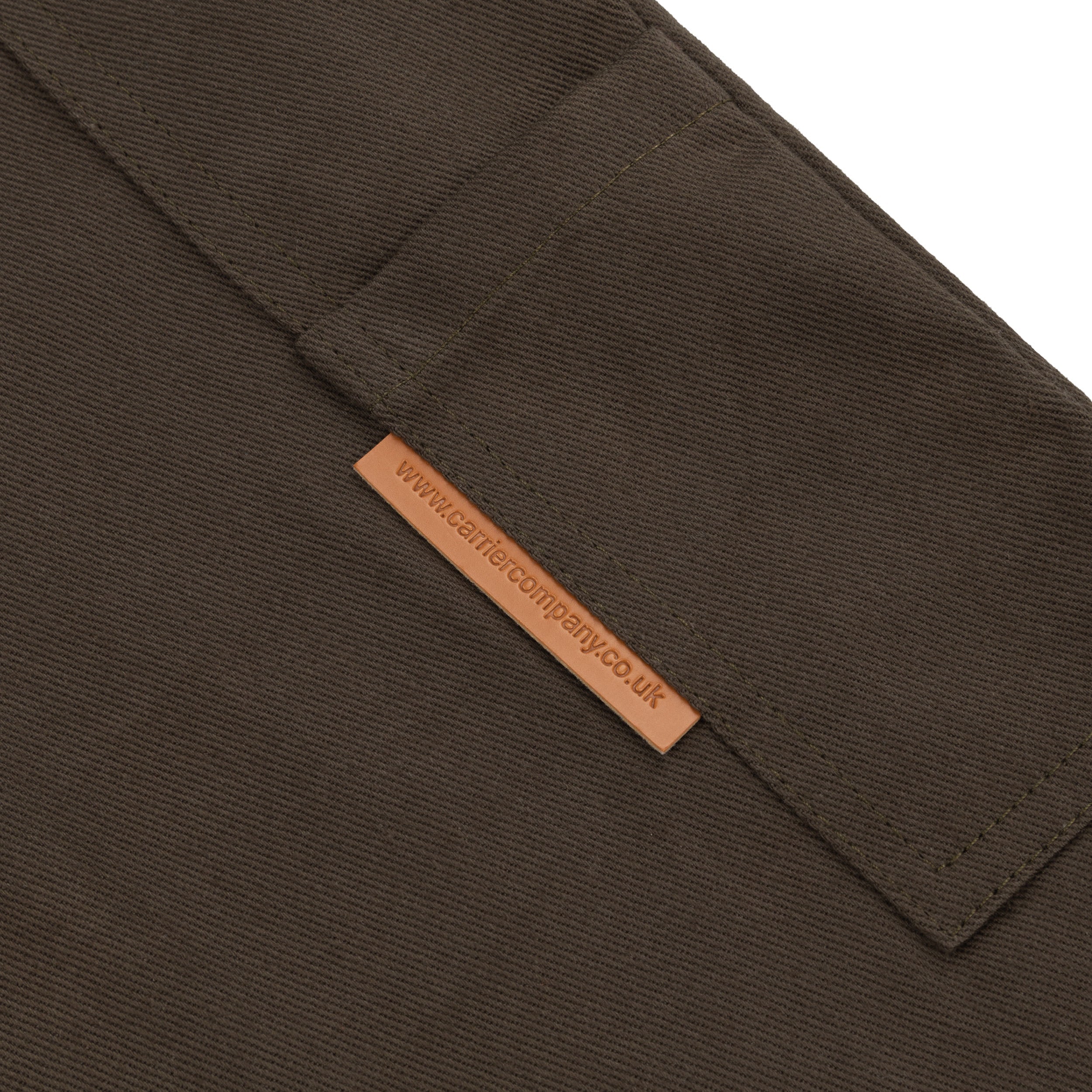 Close up of the pocket detail on the Carrier Company Men's Dungarees in Olive
