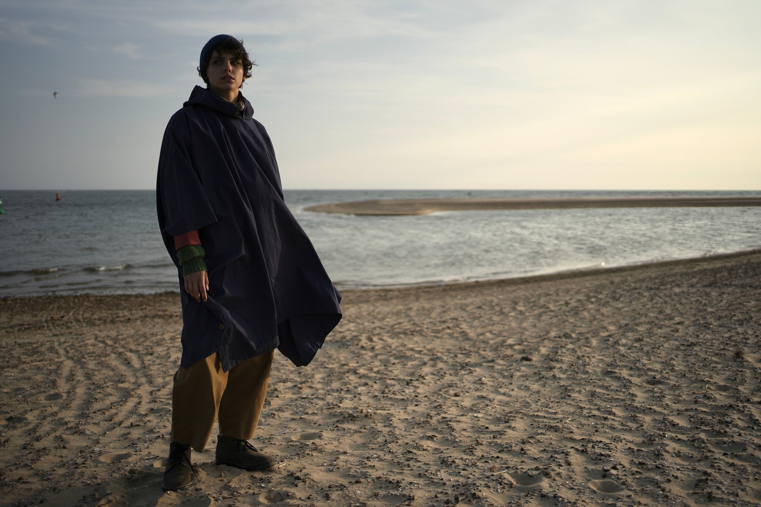 Els Wears Carrier Company navy blue hooded rain cape in navy blue.