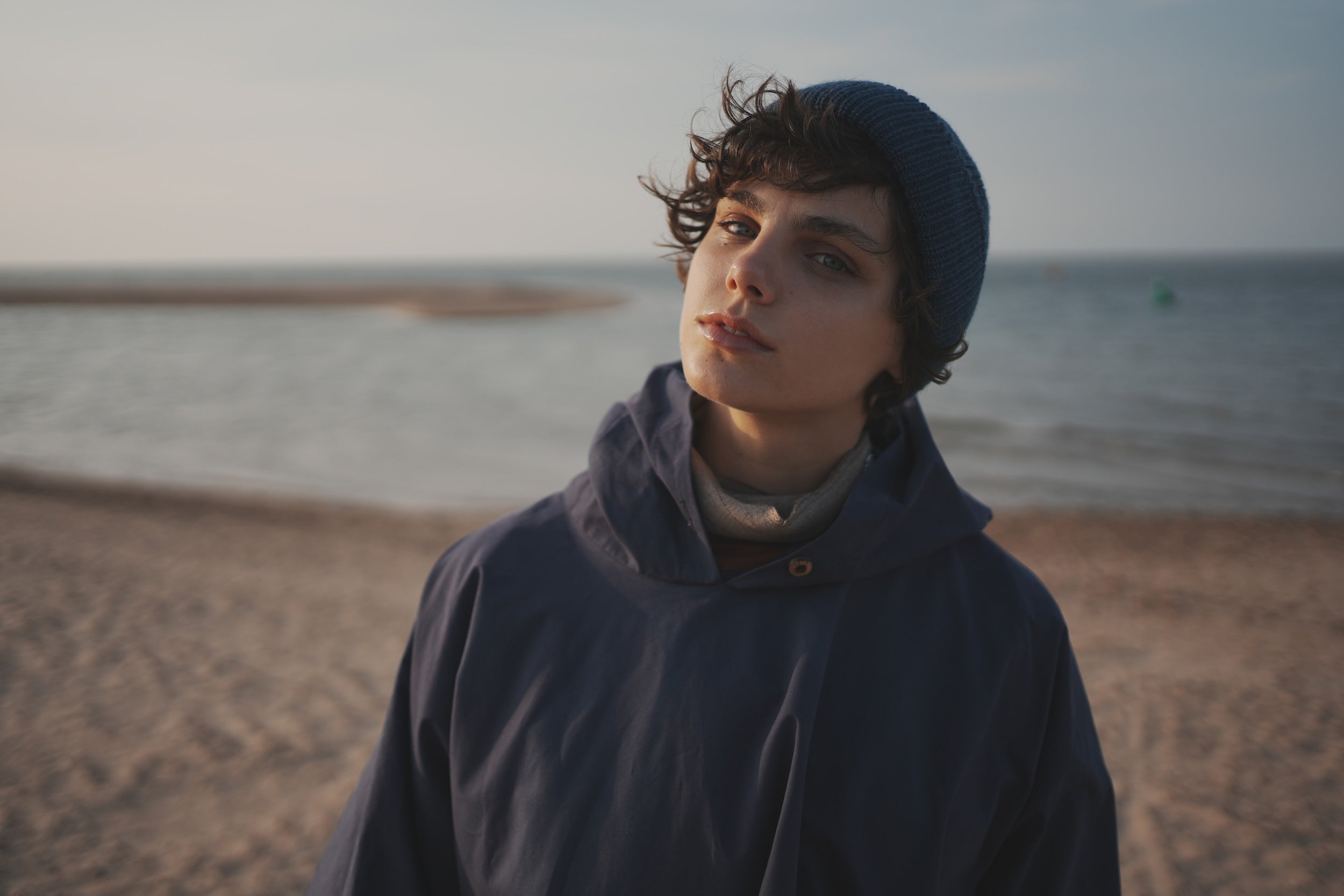 Els Wears Carrier Company navy blue hooded rain cape in navy blue.