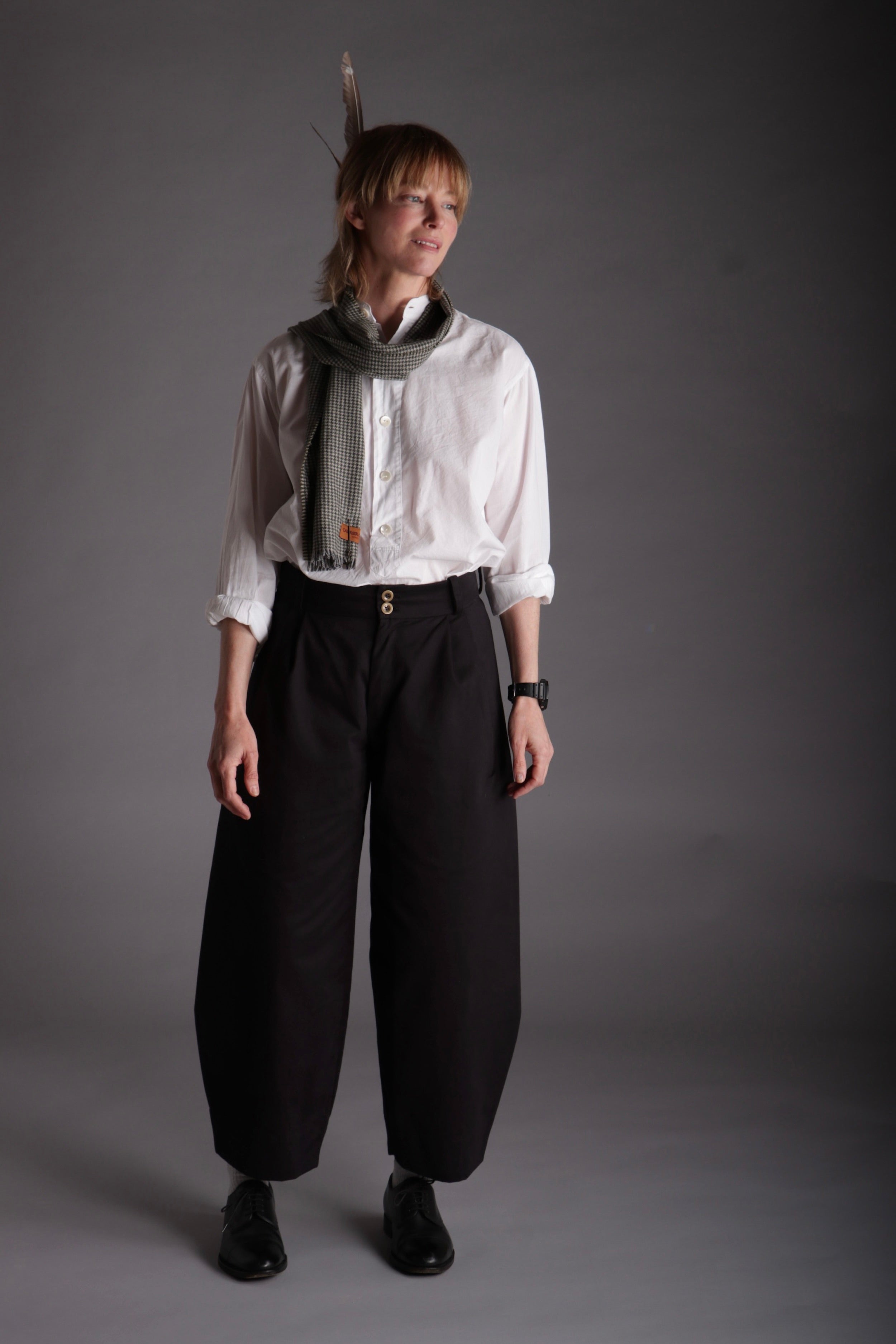 Sienna wears Carrier Company Dutch Trousers in Black Cotton Drill with Lightweight Collarless Shirt