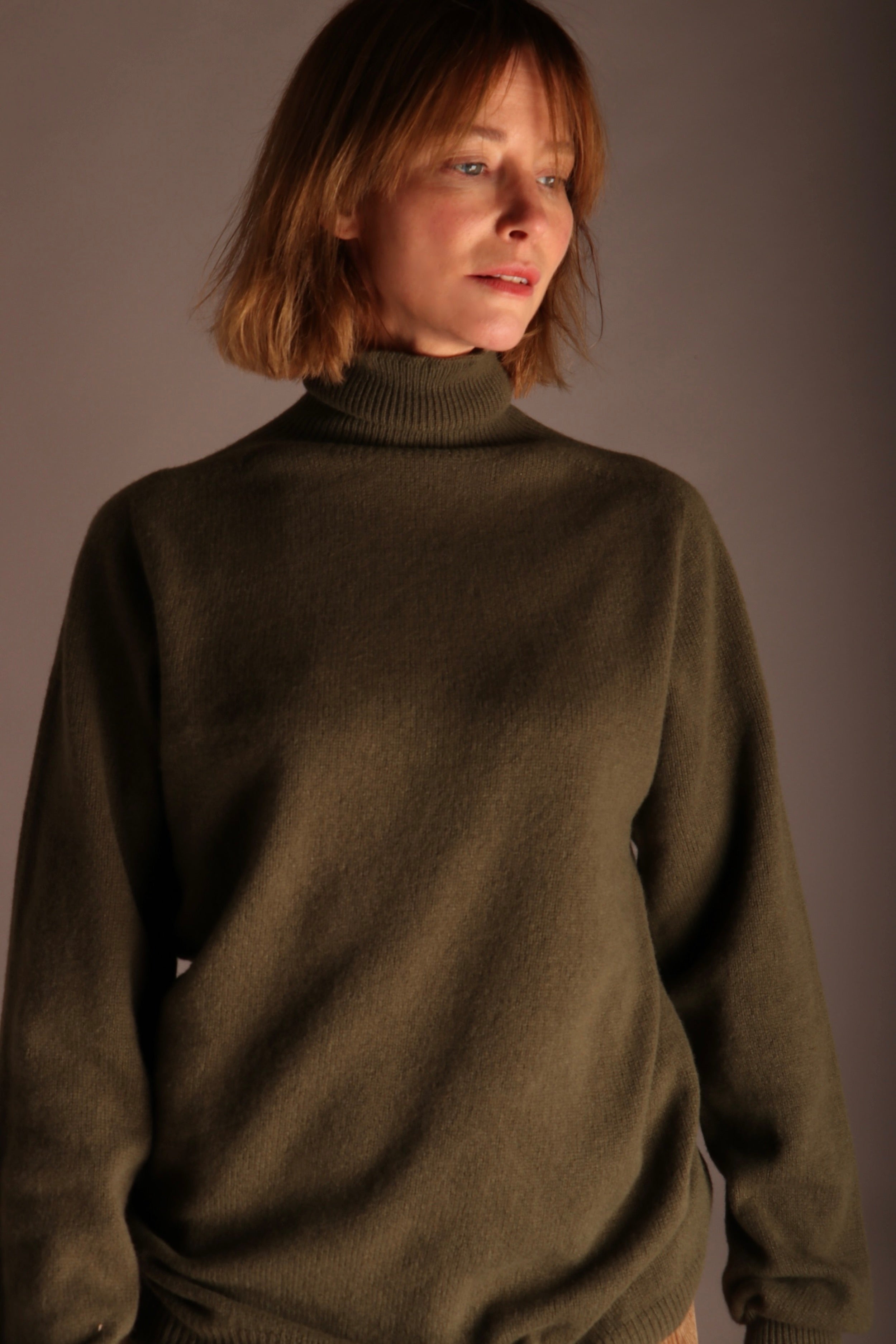 Sienna wears Carrier Company Merino & Cashmere Supersoft Roll Neck Jumper and Dutch Trousers in Corduroy