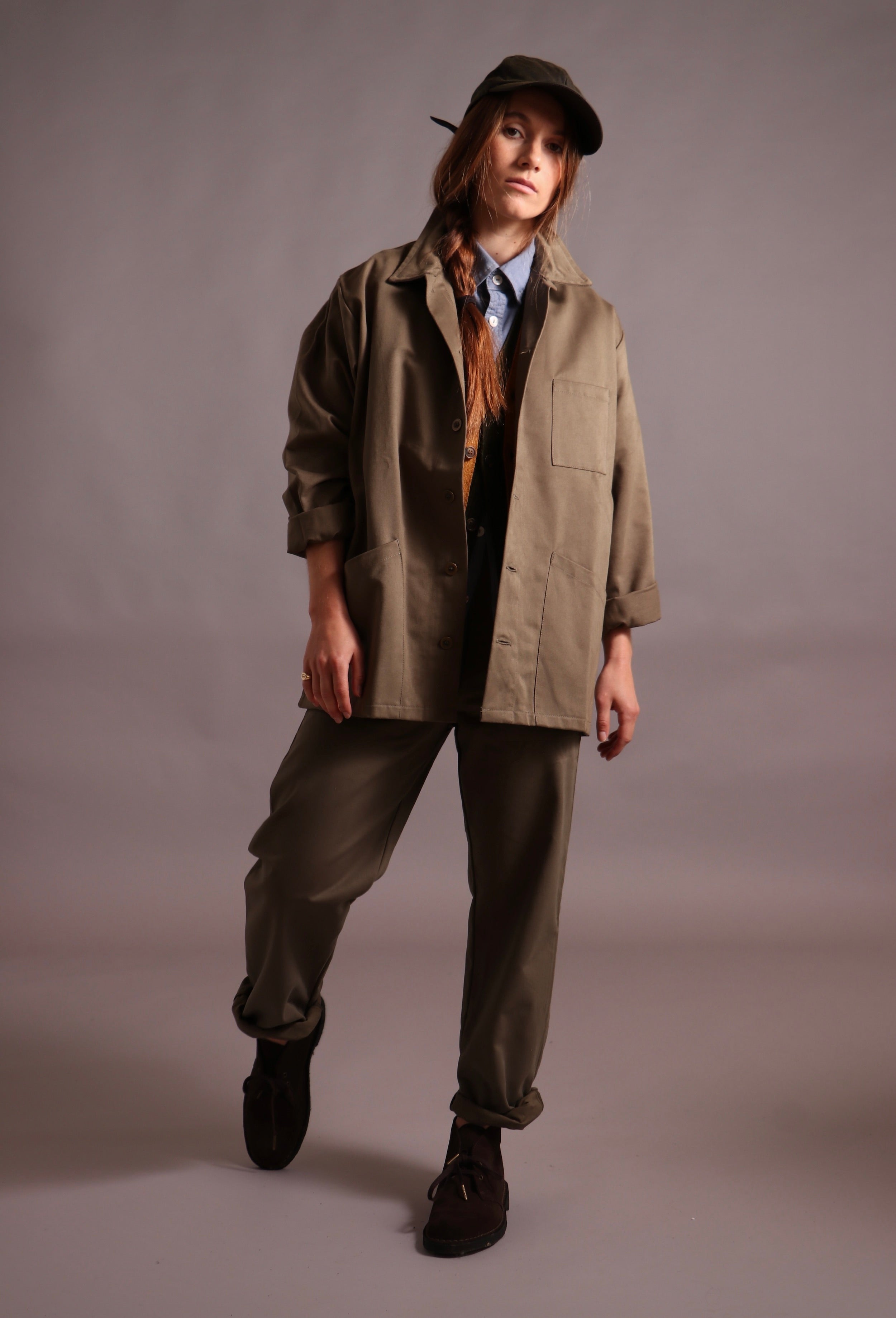 ecca wears Carrier Company Norfolk Work jacket with Sleeveless Cardigans, Pinpoint Chambray Shirt, Oilskin Cap and Women's Work Trouser