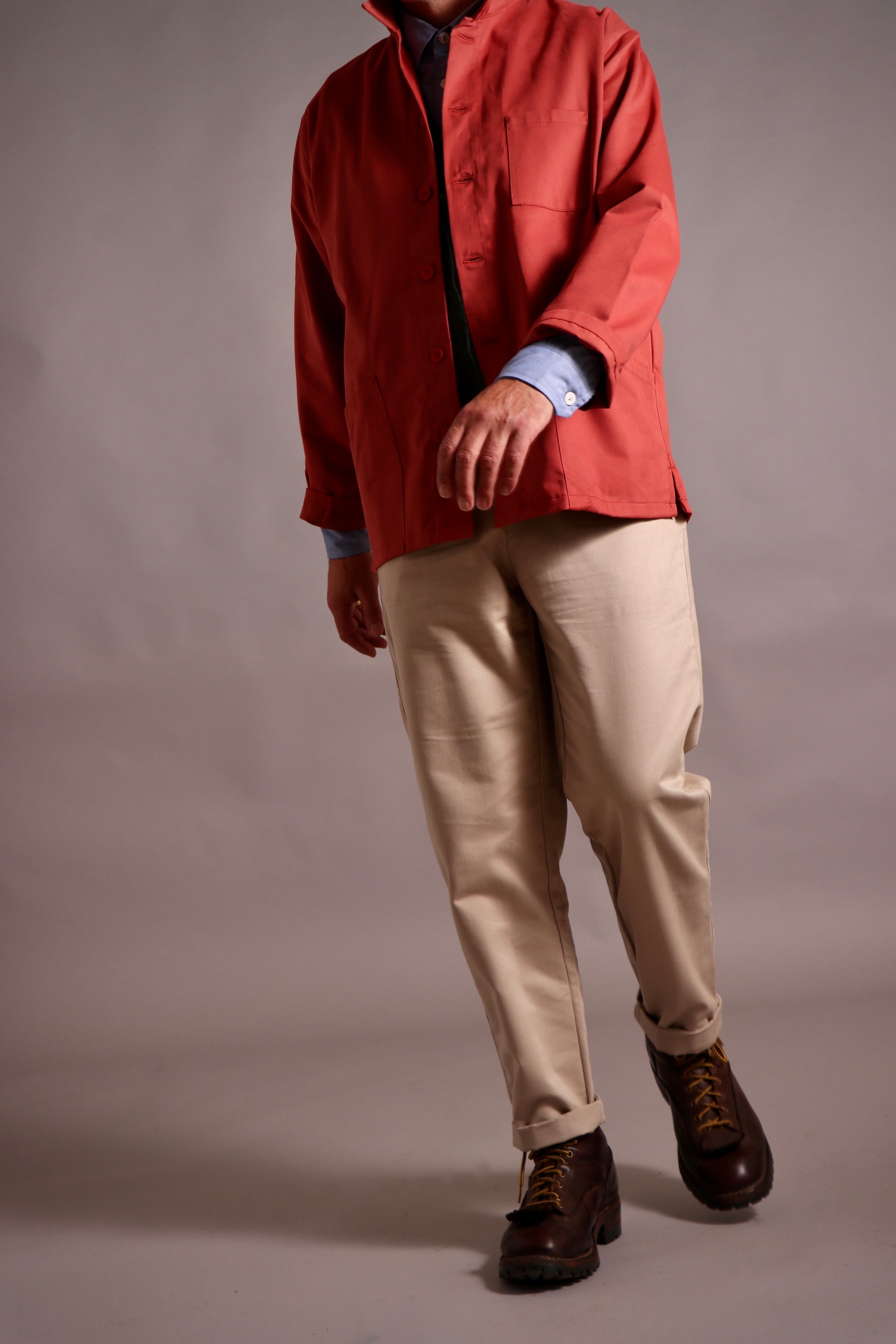 Enzo wears High Waist Trousers with Norfolk Work Jacket and Pinpoint Chambray Shirt