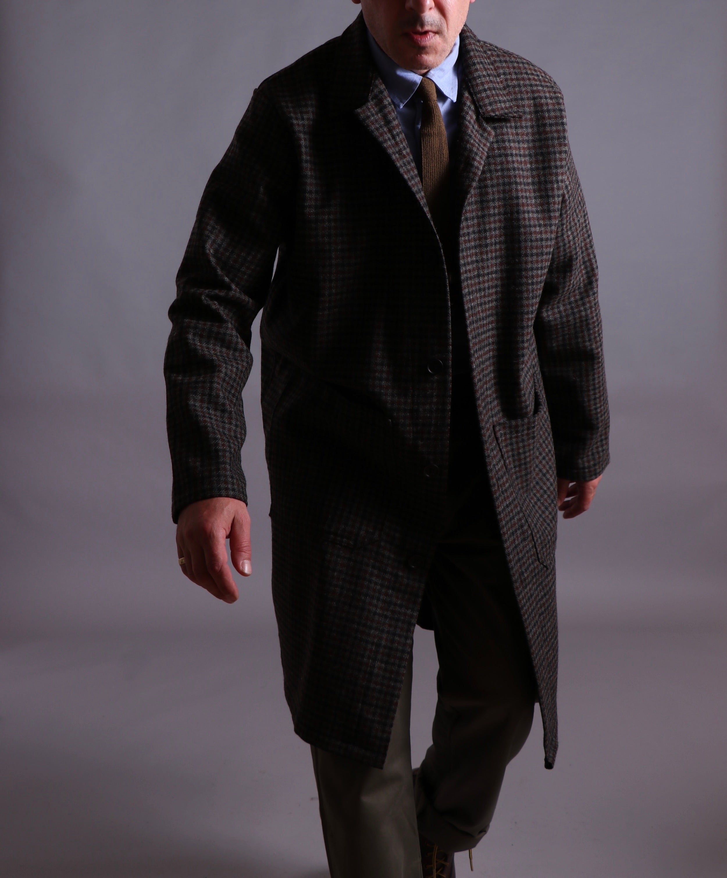 Enzo wears Carrier Company Wool Coat, with Chambray Poplin Shirt and Olive Work Trousers