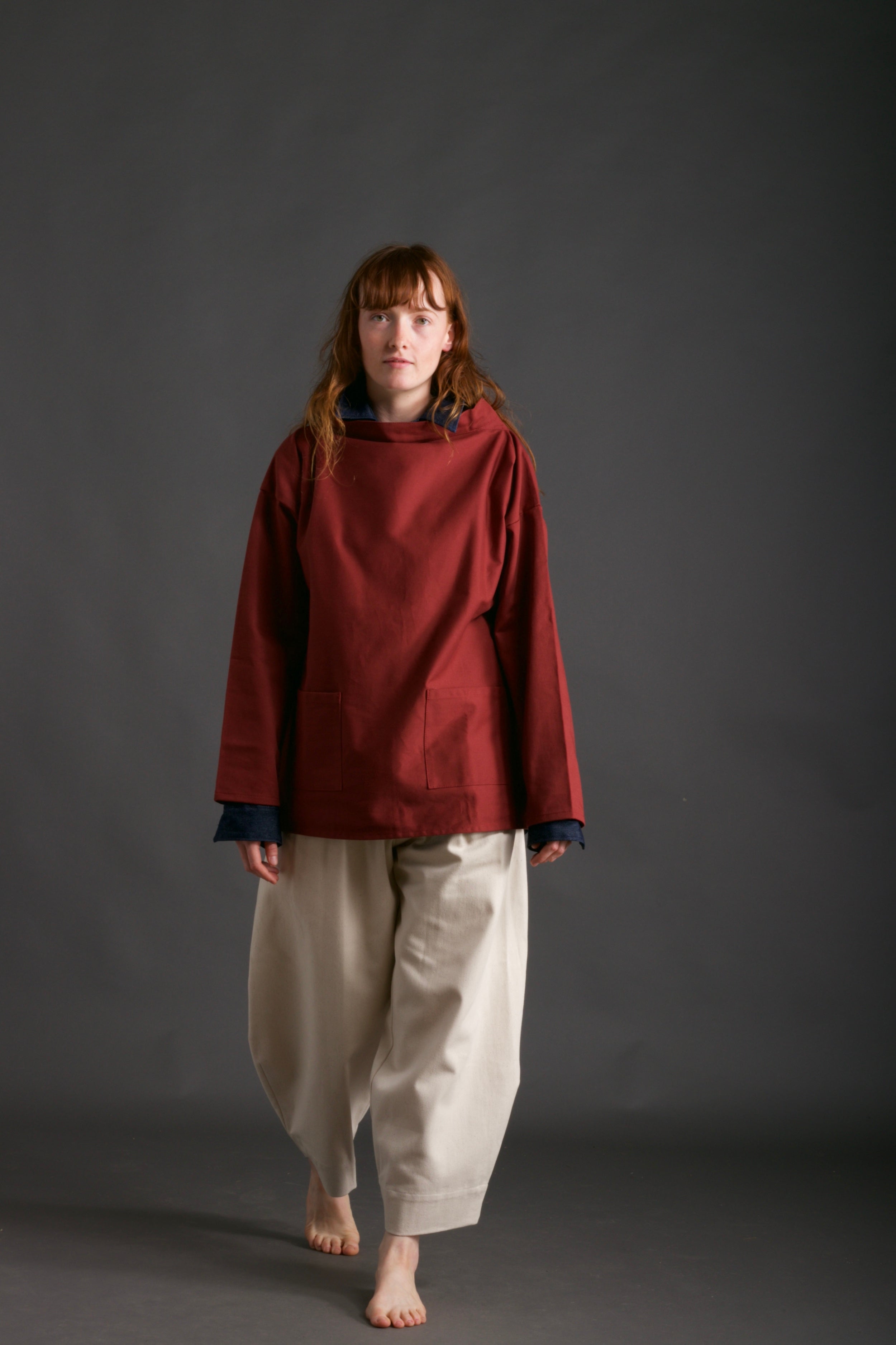 Woman wearsCarrier Company Traditional Norfolk Slop in Breton Red with Dutch Trouser in Seeded Denim