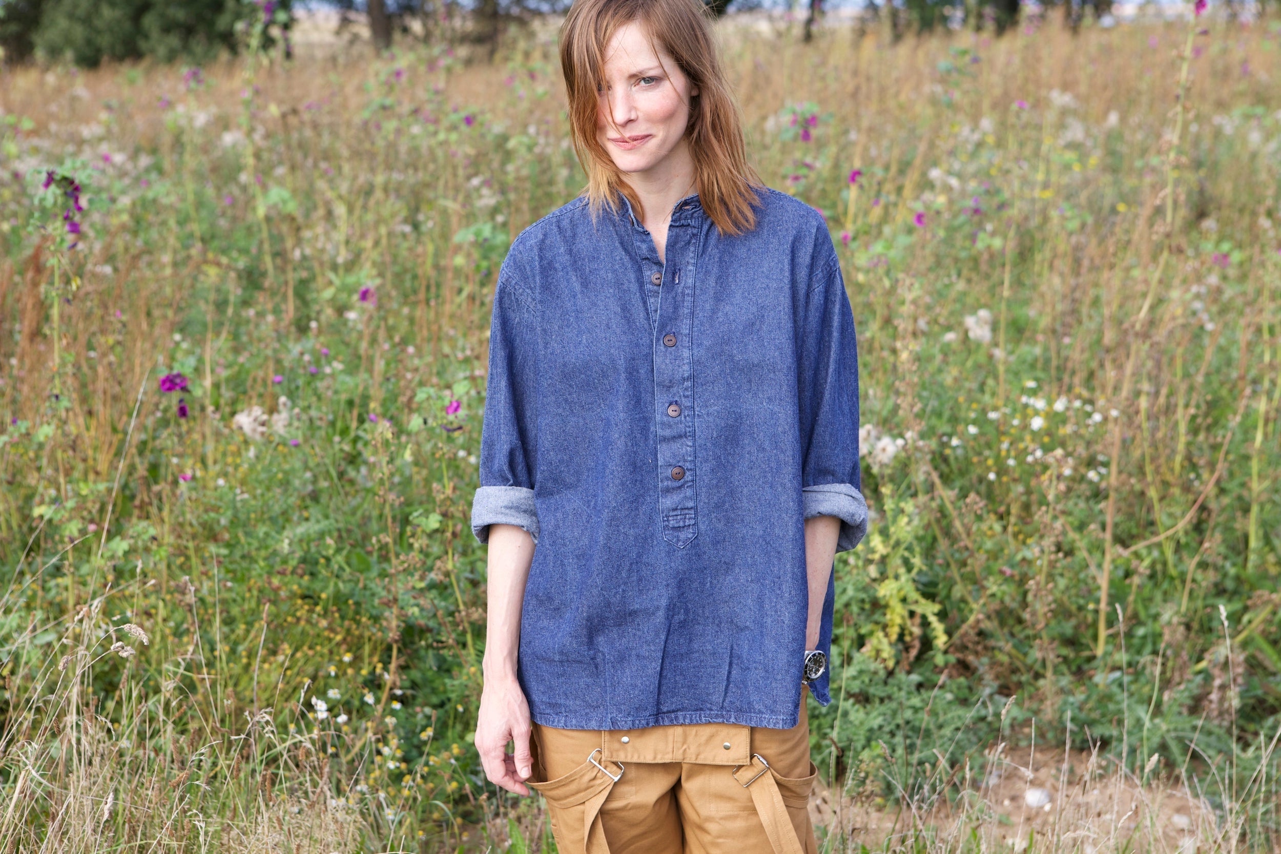 Woman wearing carrier Company Denim Work Shirt and Women's Dungarees in Tan Cotton Drill