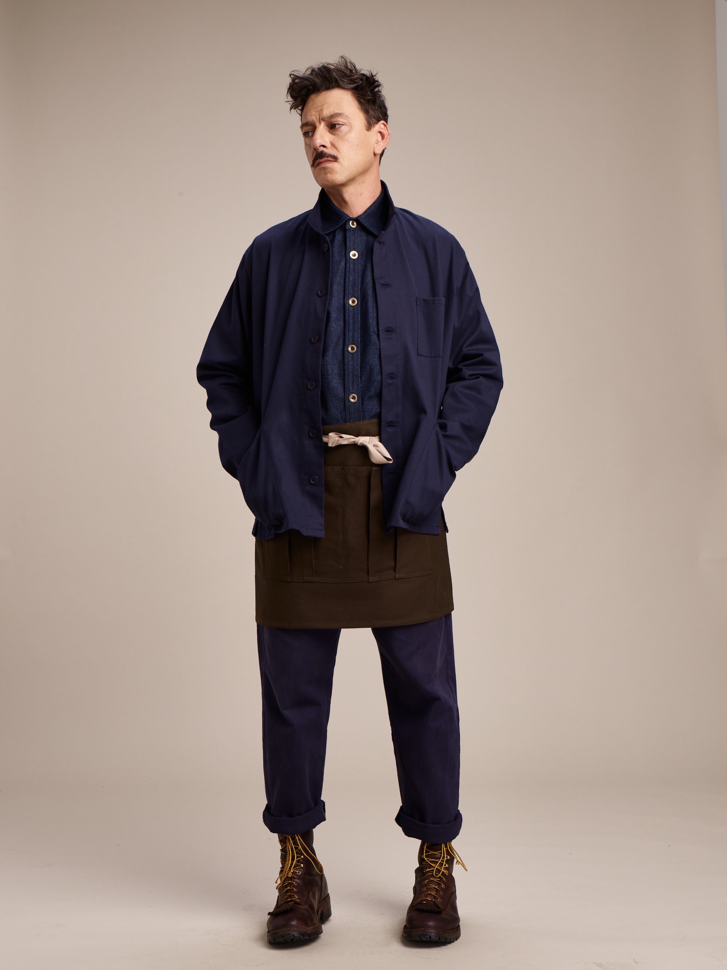 Man wears Carrier Company Gardener's Half Apron