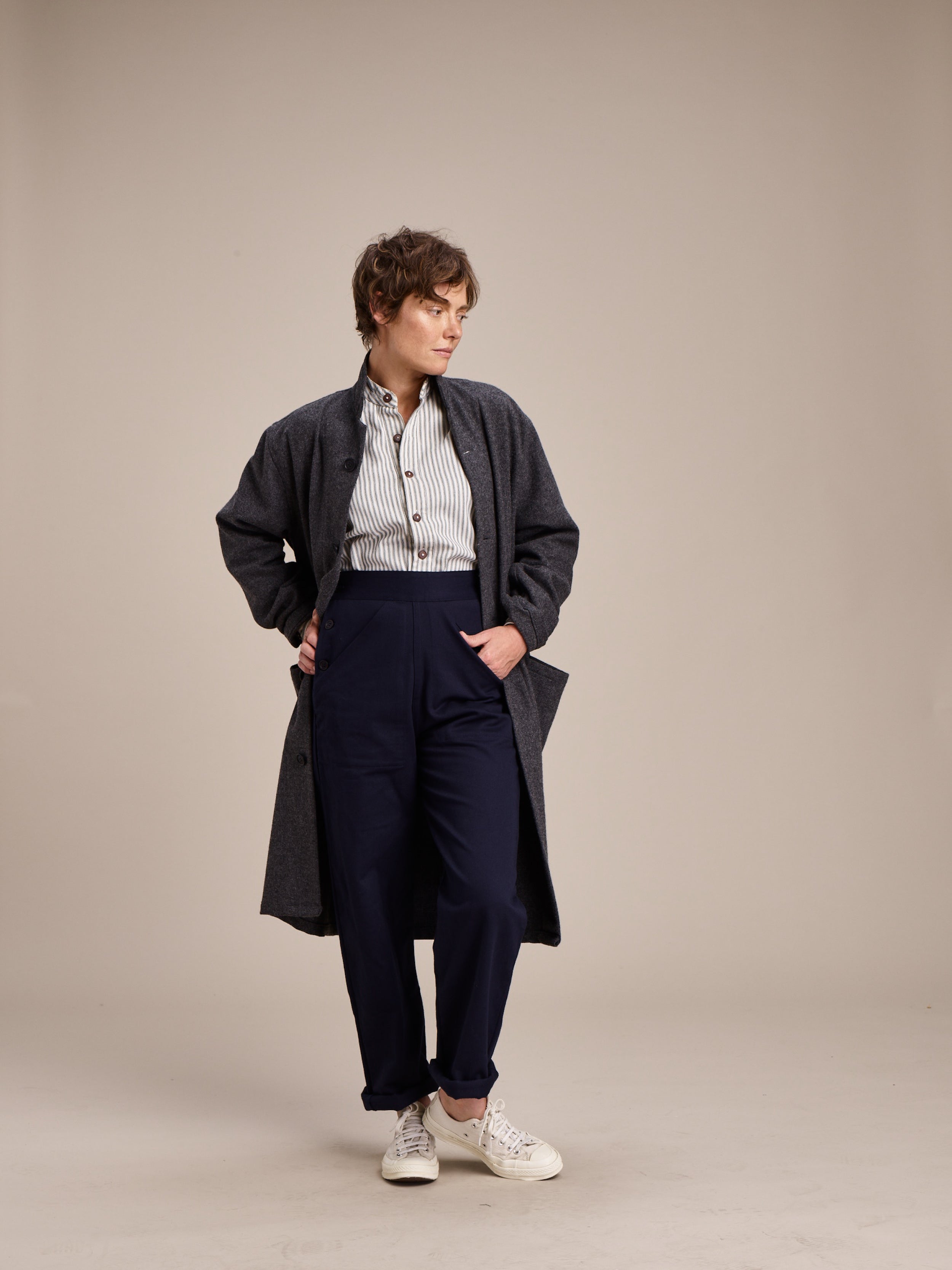 Woman wearing Carrier Company Wool Coat in Grey with Ticking Work Shirt and Women's Work Trouser in Navy