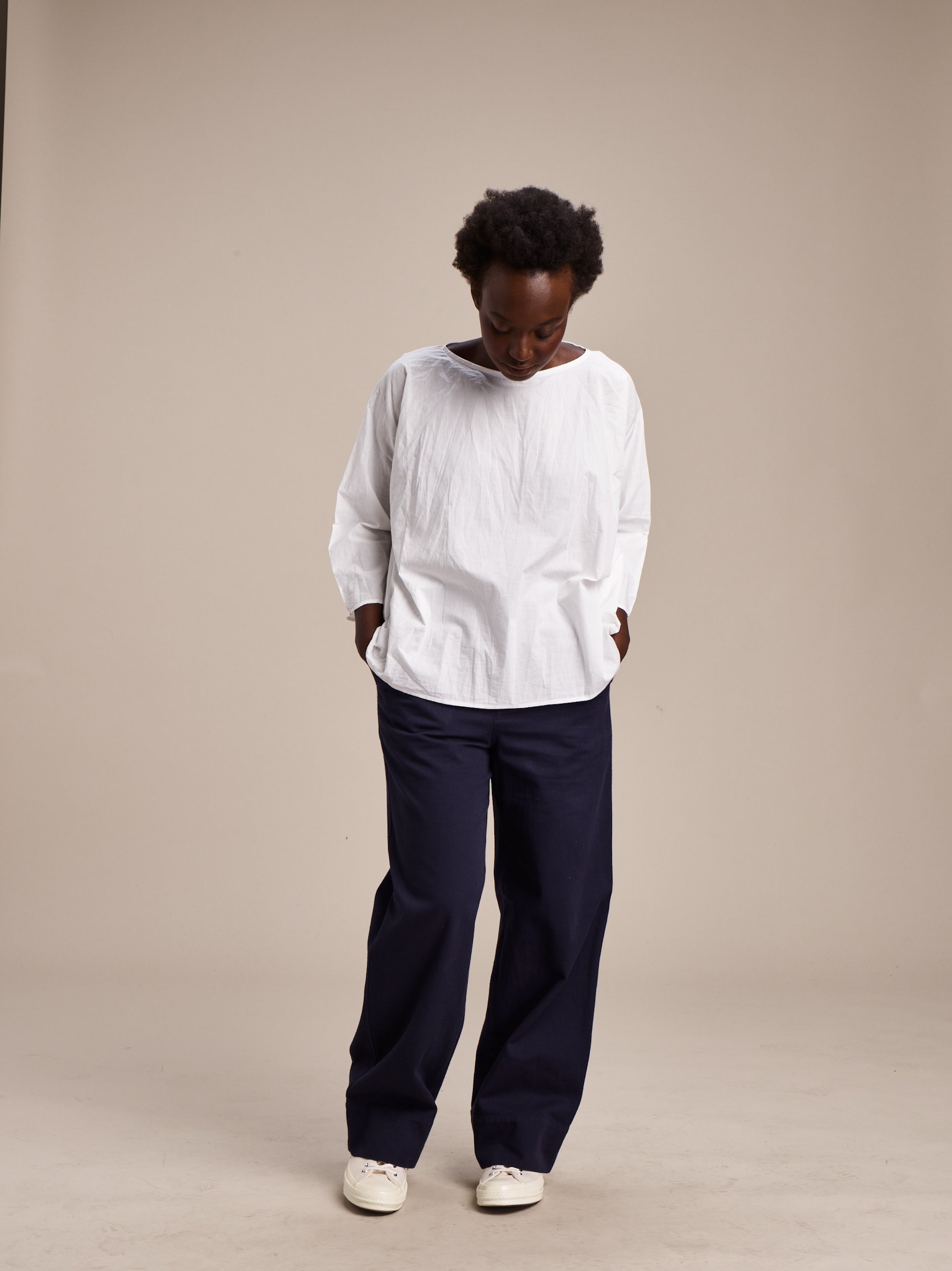 Woman wears Carrier Company White Cotton Tee Shirt