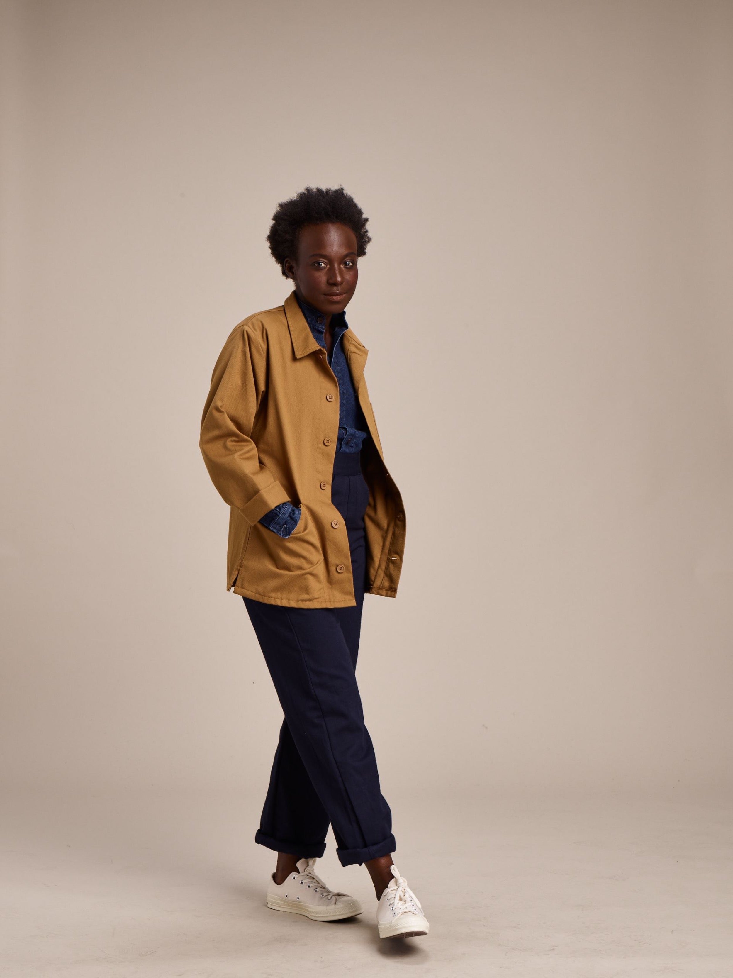Woman wearing Carrier Company Work Jacket in Tan with Denim Work Shirt and Women's Work Trouser