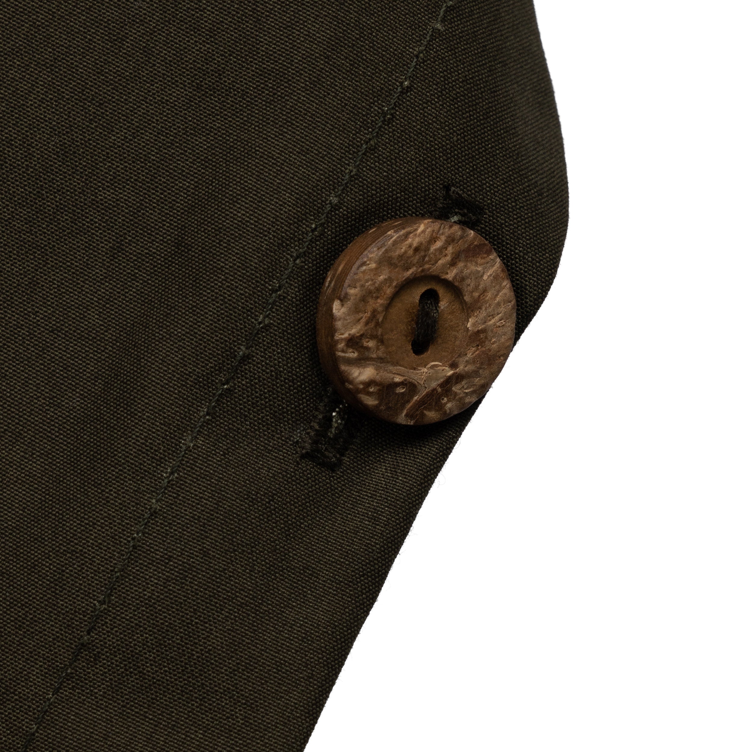 Close up of the button detail on the Carrier Company Long Rain Cape