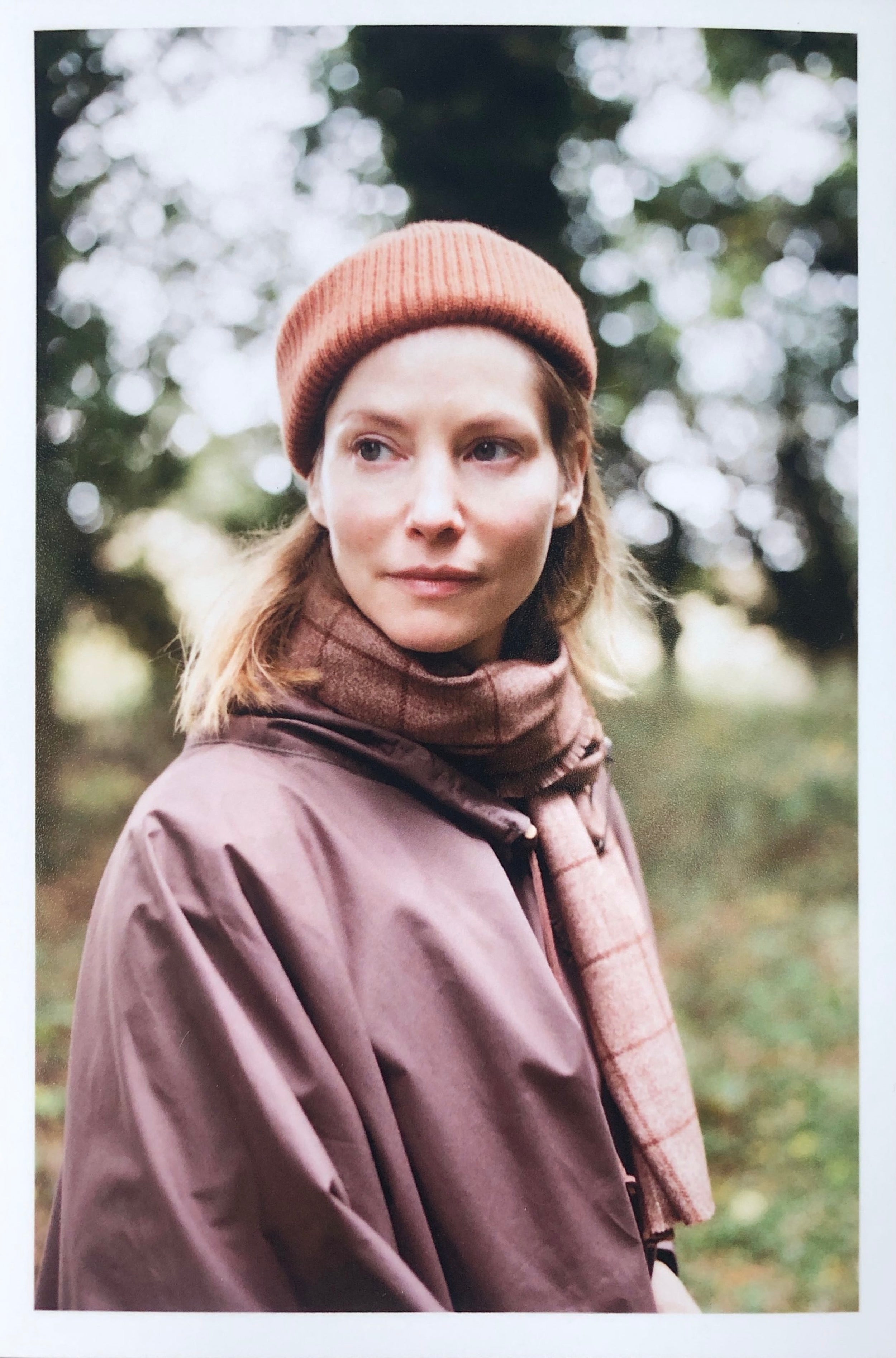 Woman wearing Carrier Company Rain Cape with Wool Hat and Short Scarf