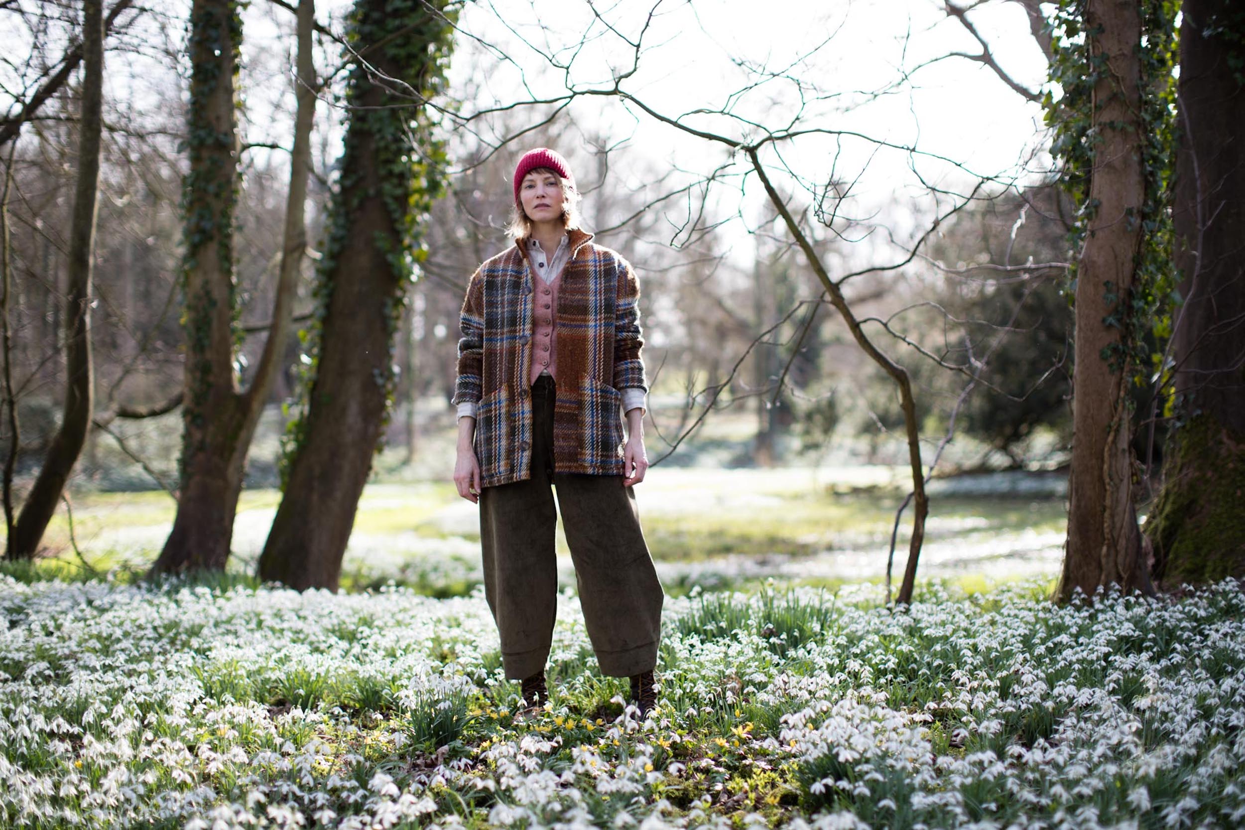 Woman wears Carrier Company Celtic Wool Jacket in Russett