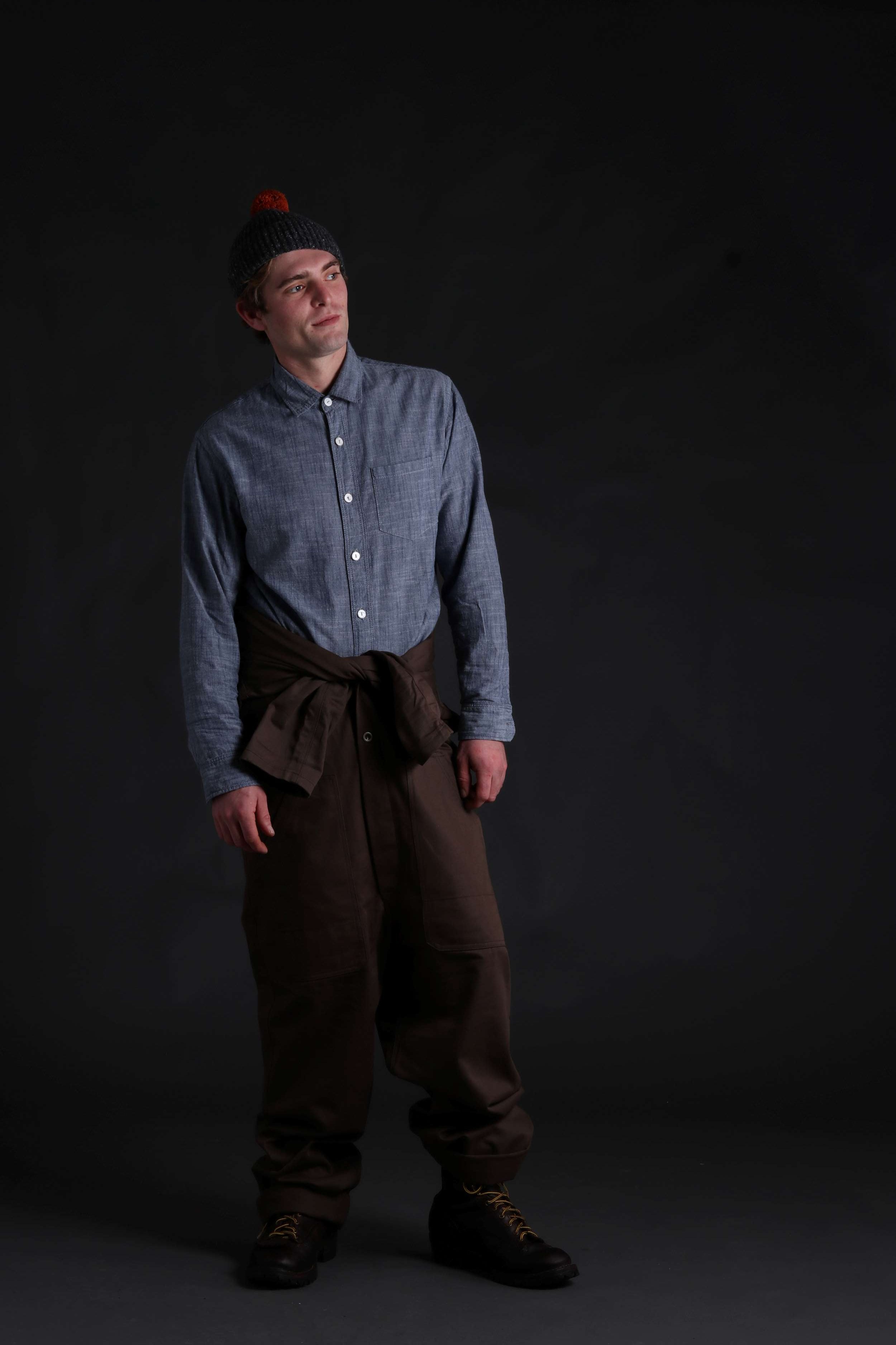 Man wearing Carrier Company Boiler Suit with Chambray Shirt and Pompom Donegal Hat