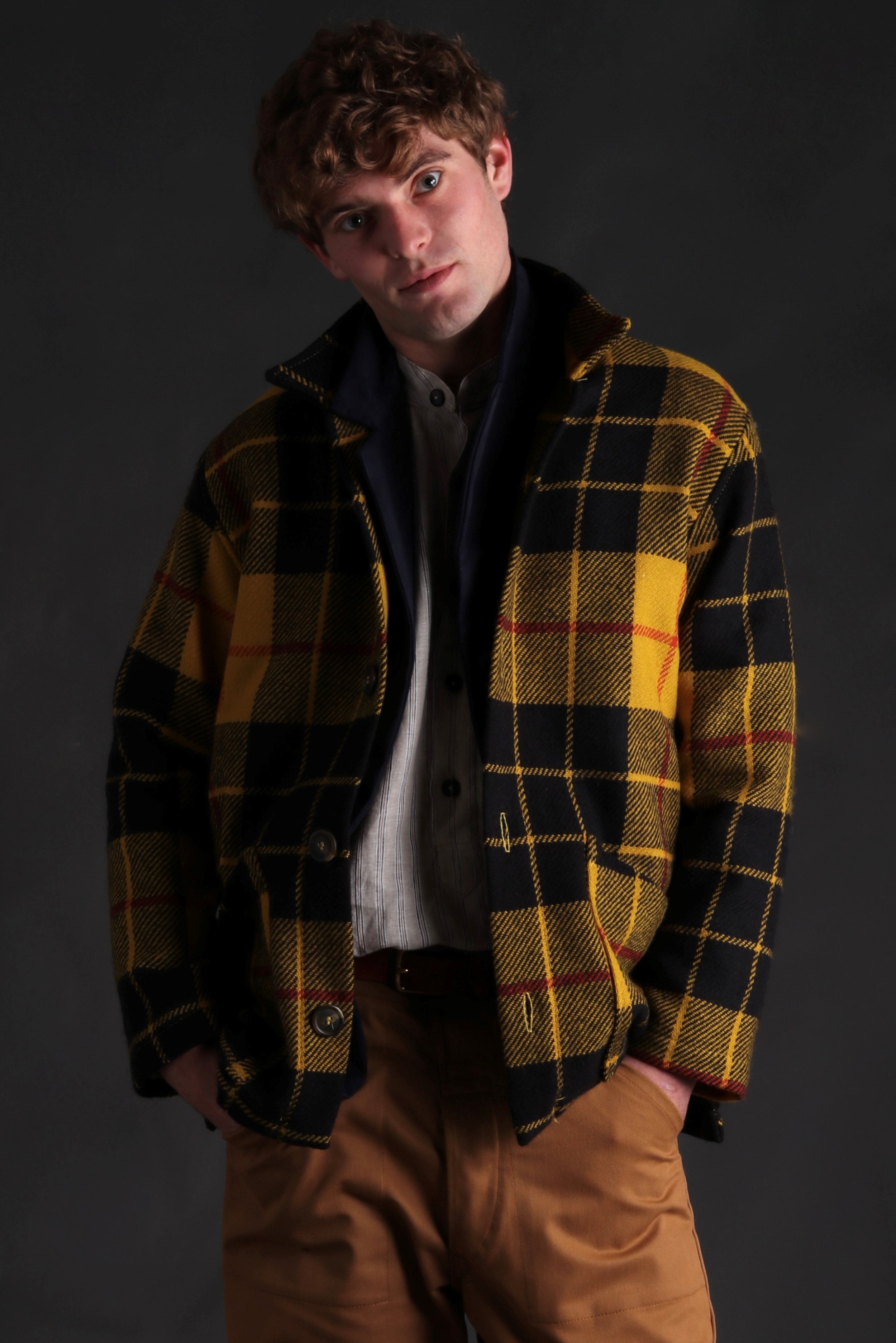 Man wearing Celtic Wool Jacket in Yellow with Mens Work Trouser in Tan