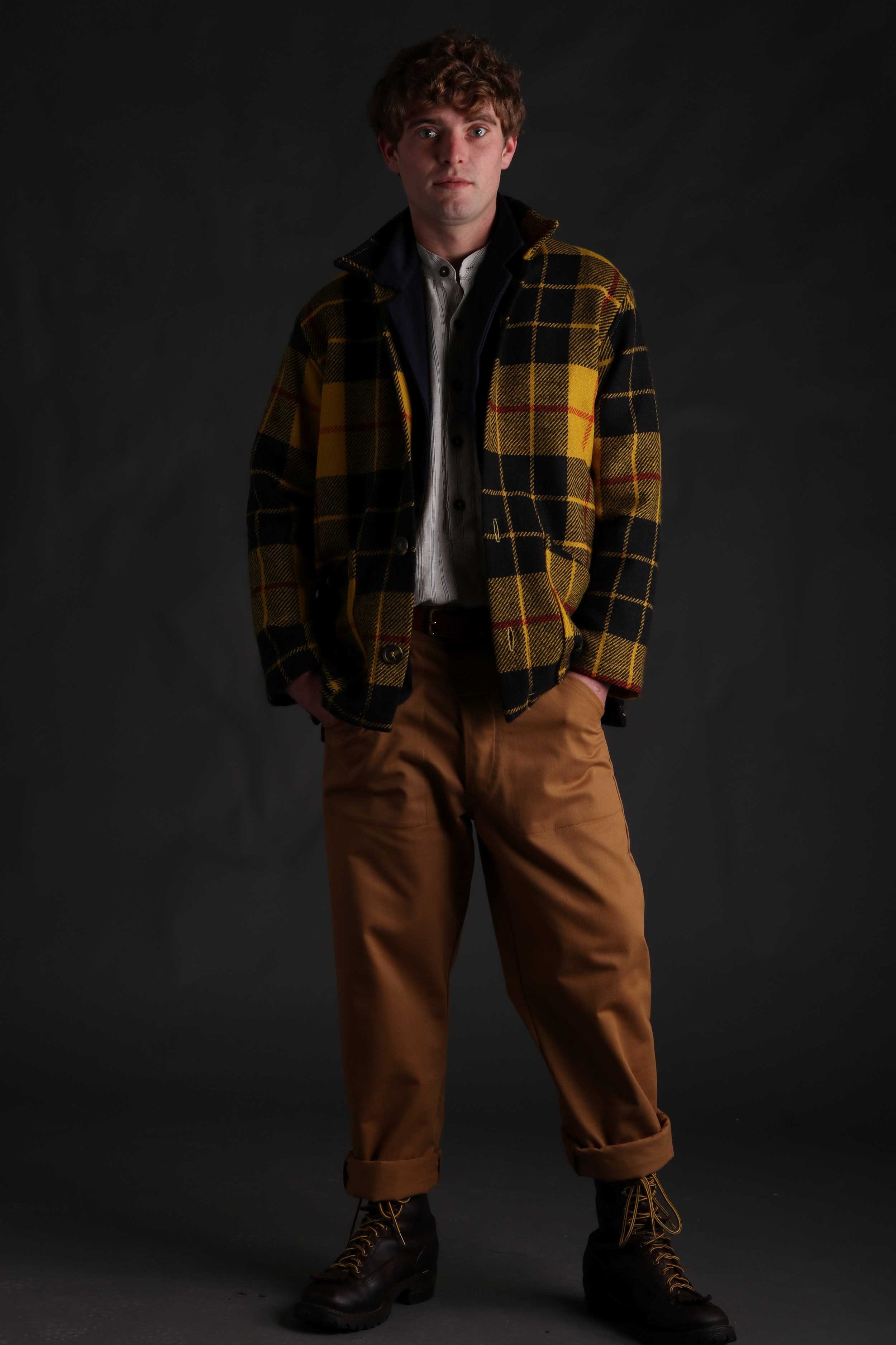 Man wearing Celtic Wool Jacket in Yellow with Mens Work Trouser in Tan