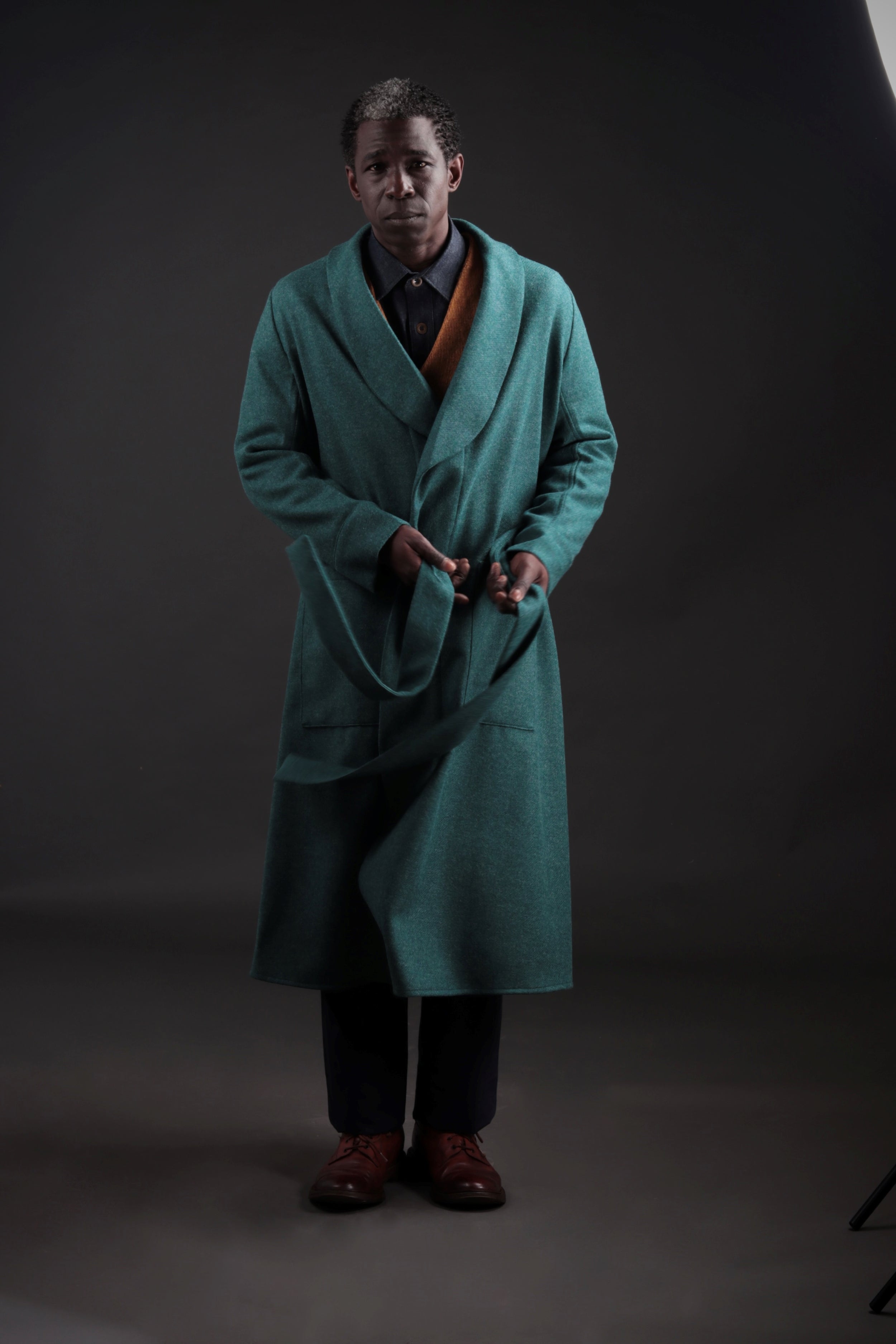 Man wears Carrier Company Wool Dressing Gown in New Teal