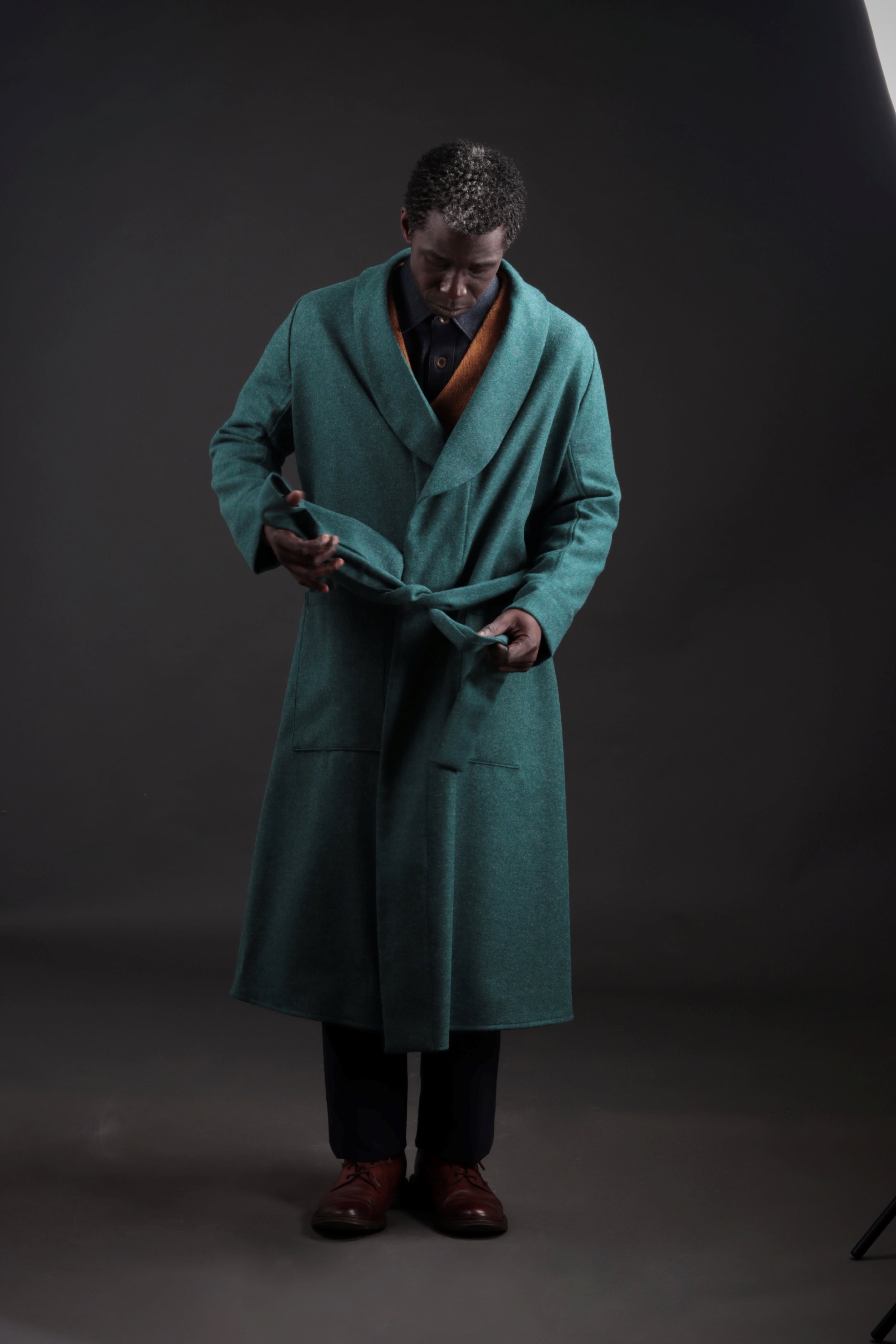 Man wears Carrier Company Wool Dressing Gown in New Teal