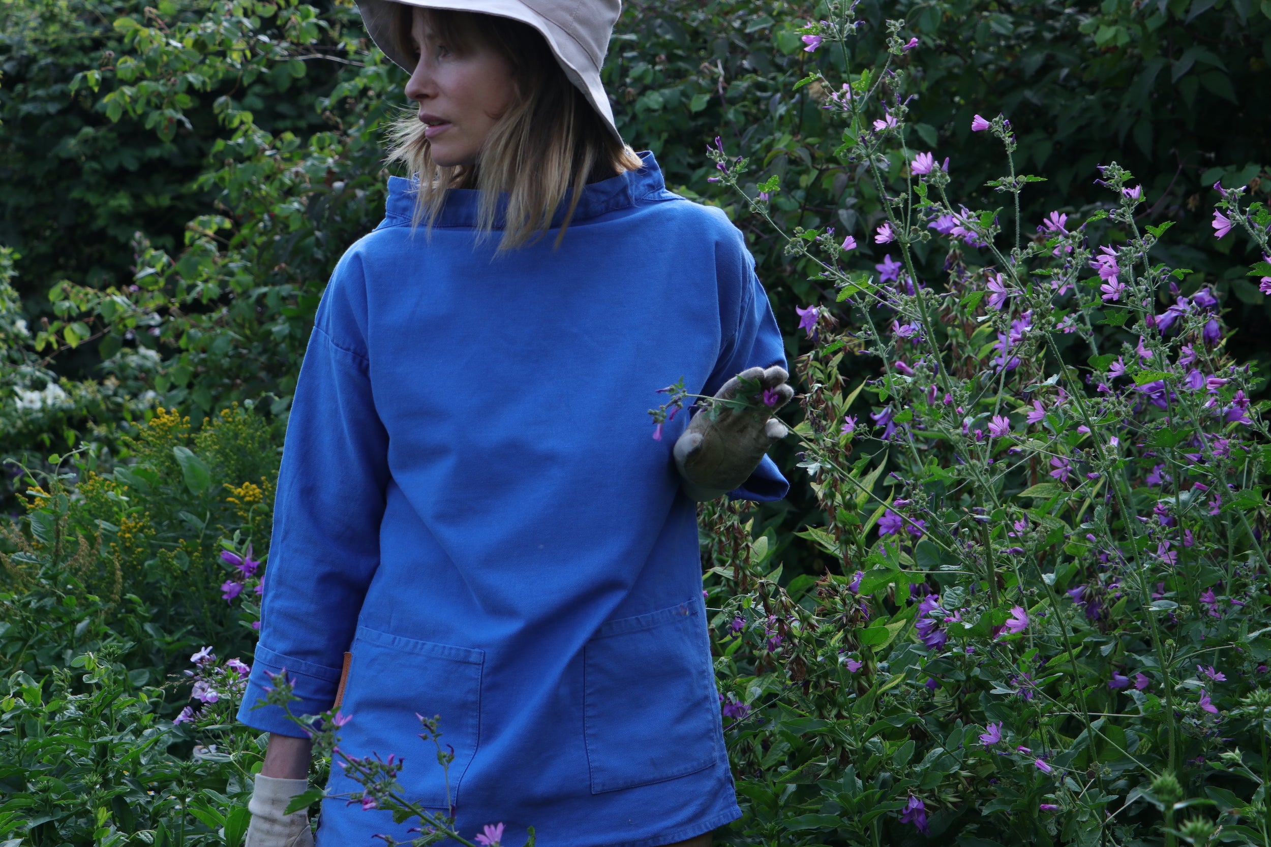 Woman gardening and wearing Carrier Company Traditional Norfolk Slop in Sky Blue