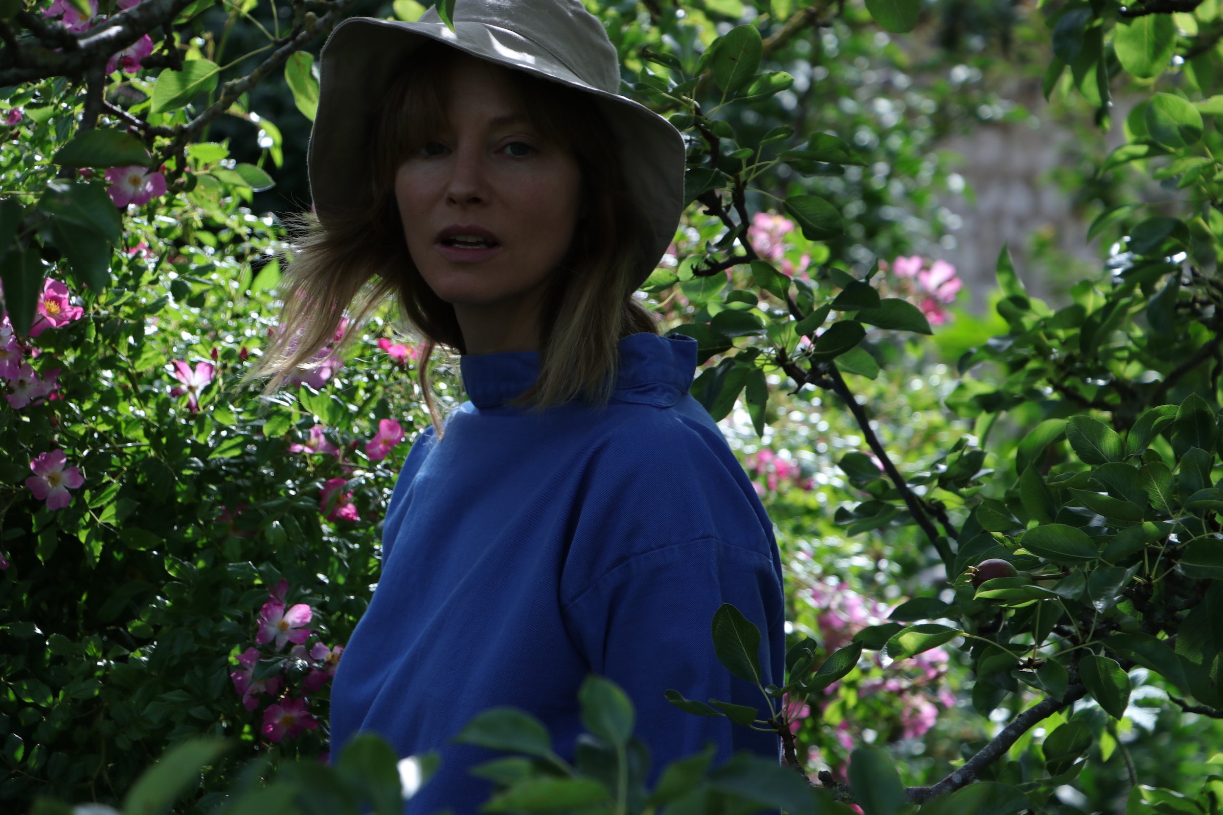 Woman wearing Carrier Company Cotton Sun Hat with Traditional Norfolk Slop in Sky Blue