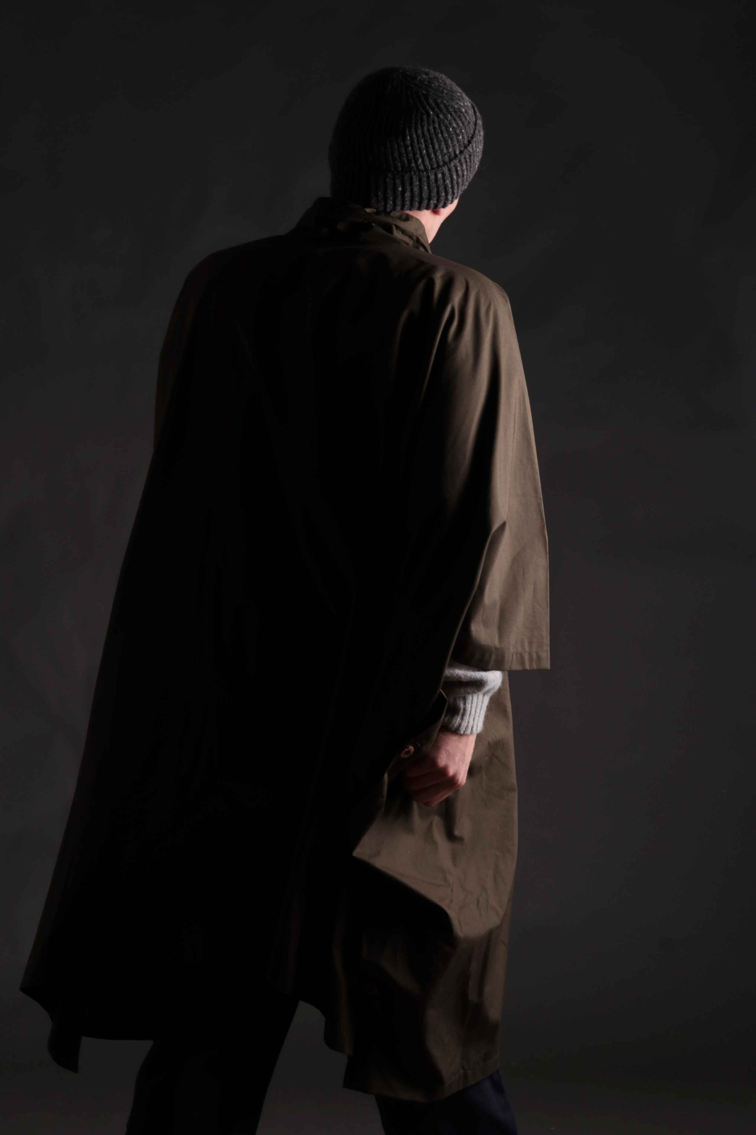 Man wears Long Rain Cape in Olive with Donegal Hat