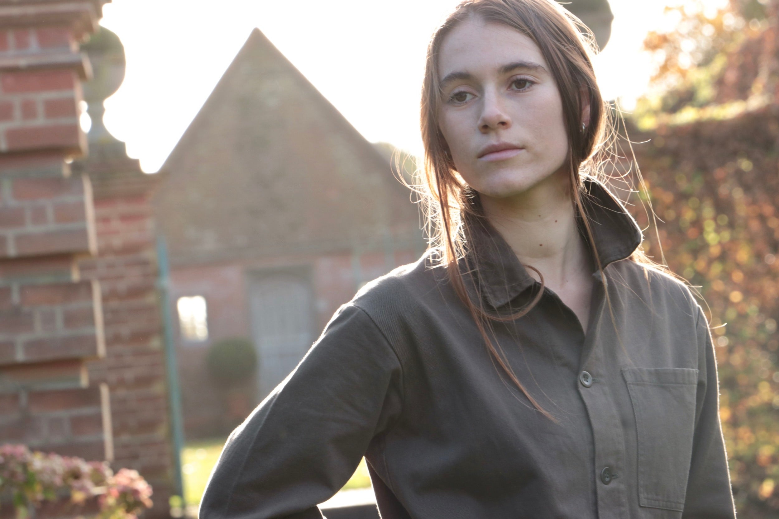Decca wears Carrier Company Boiler Suit in Olive Drill with Chestnut Leather Belt