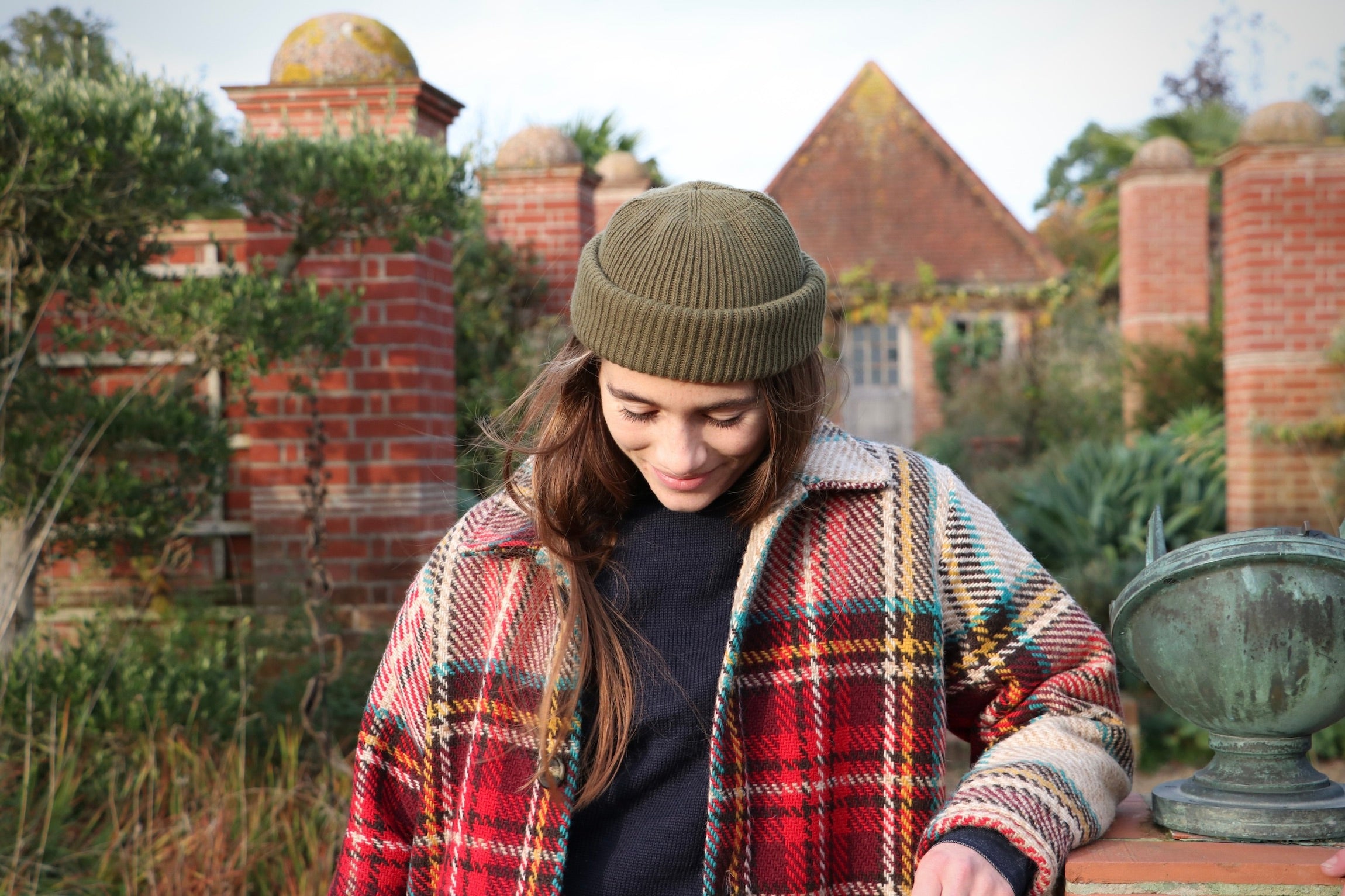 Decca wears Le Tricoteur Premium Guernsey in Navy with Wool Hat in Olive Drab and Celtic Wool Jacket