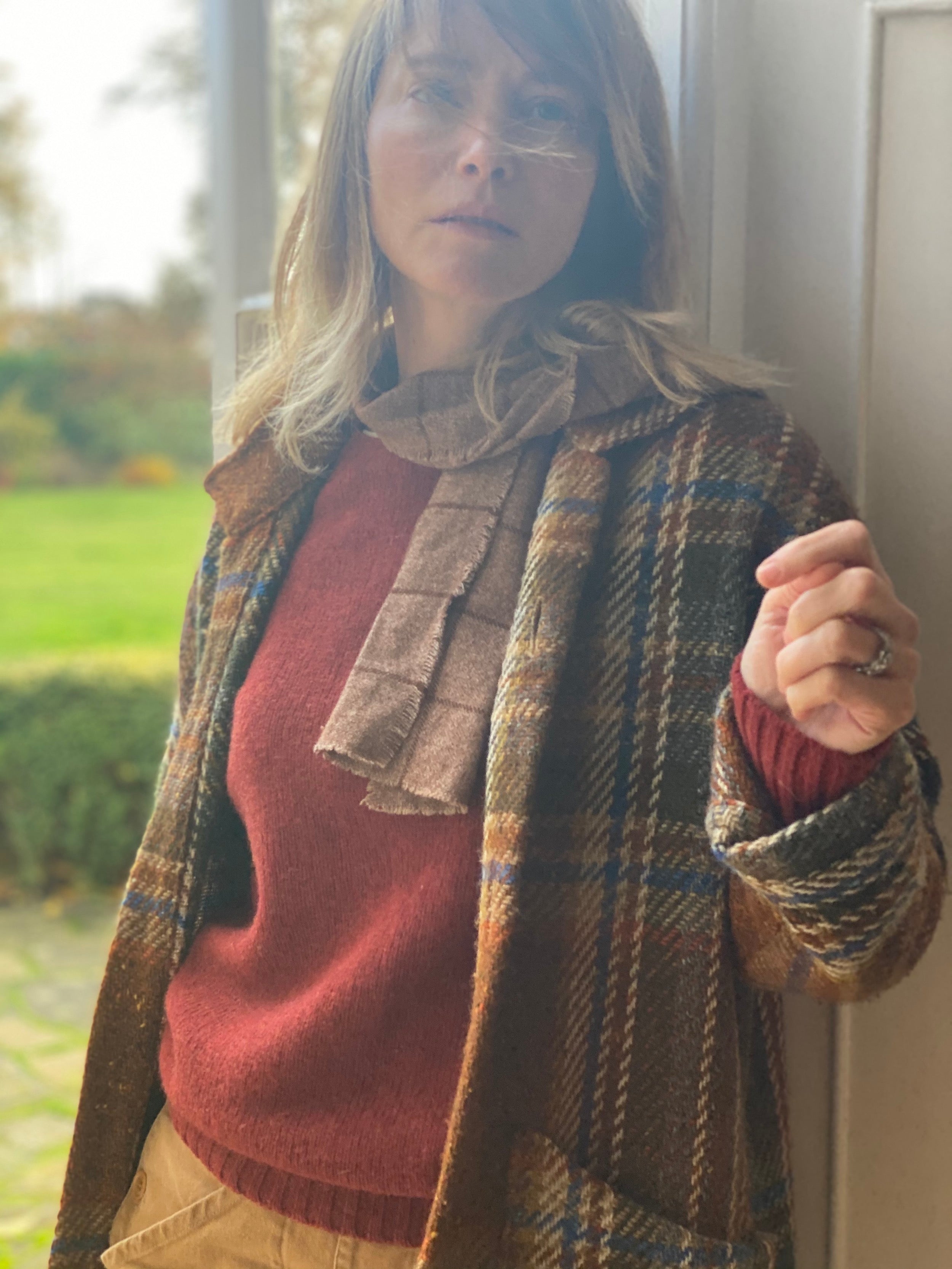 Woman wears Carrier Company Celtic Wool Jacket in Russett