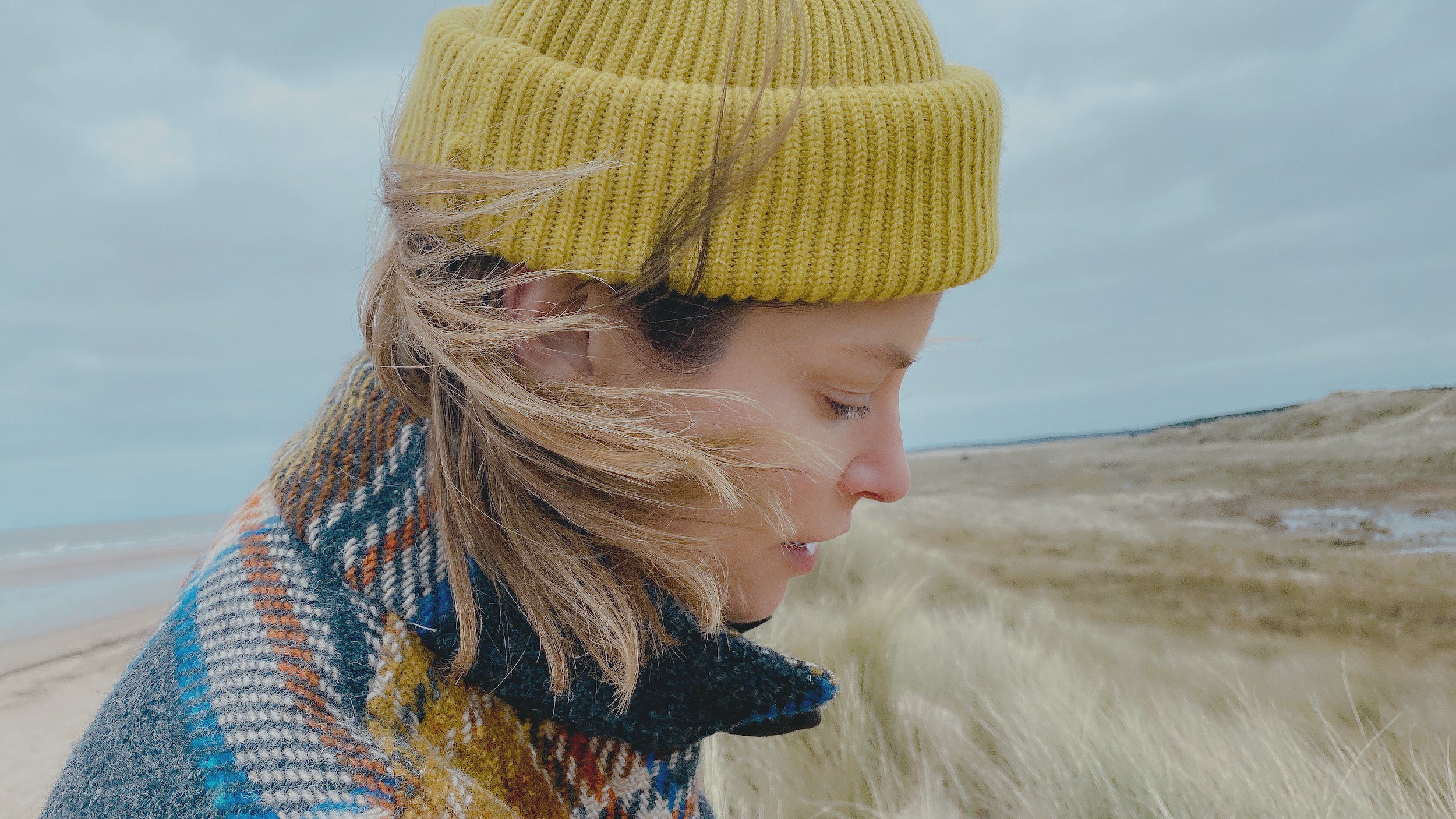 Woman wearing Carrier Company Wool Hat in Yellow  with Celtic Wool Jacket in Russet