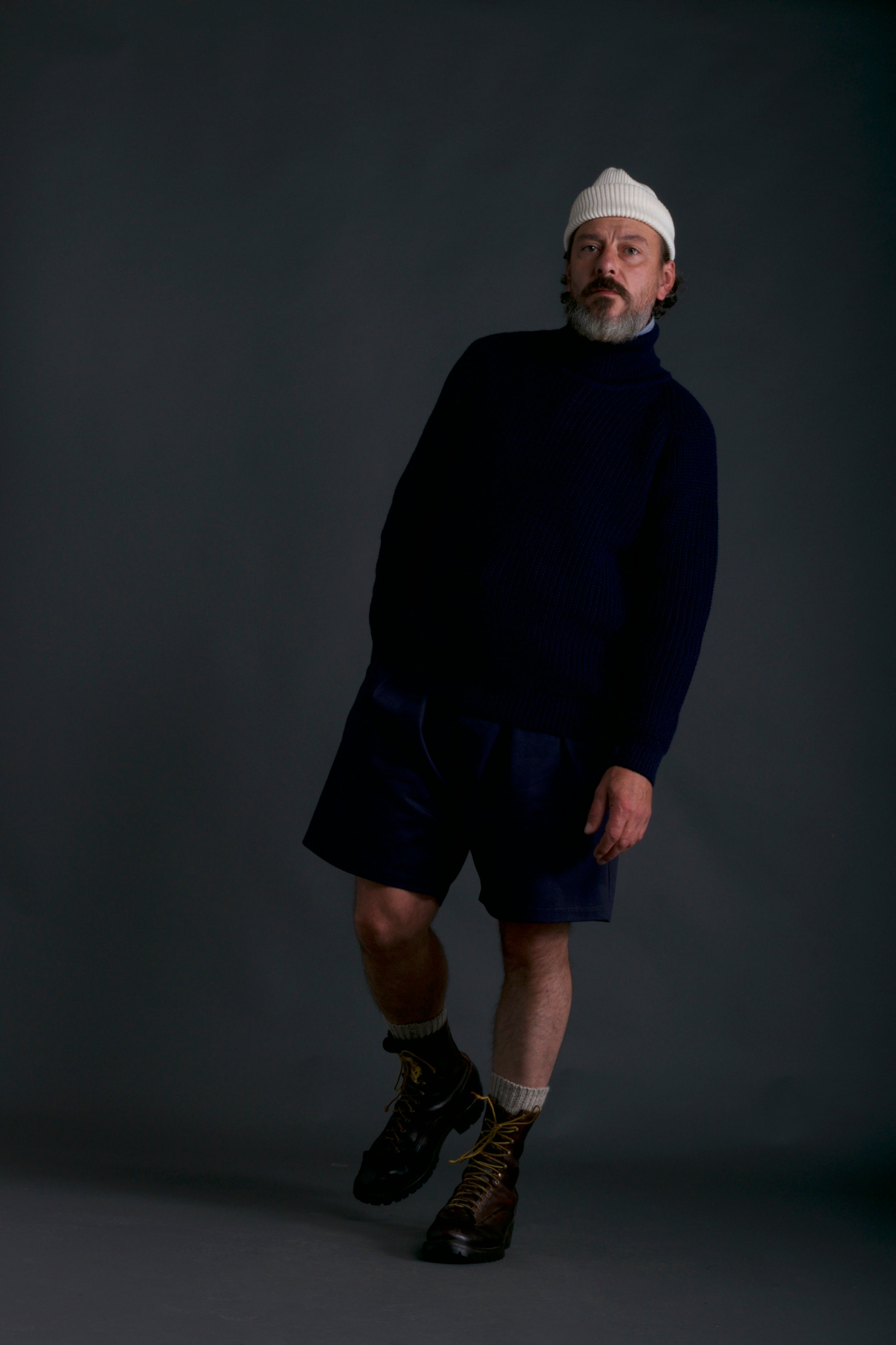 Man wears Carrier Company Fisherman's Jumper with Grandpa Shorts and Wool Hat