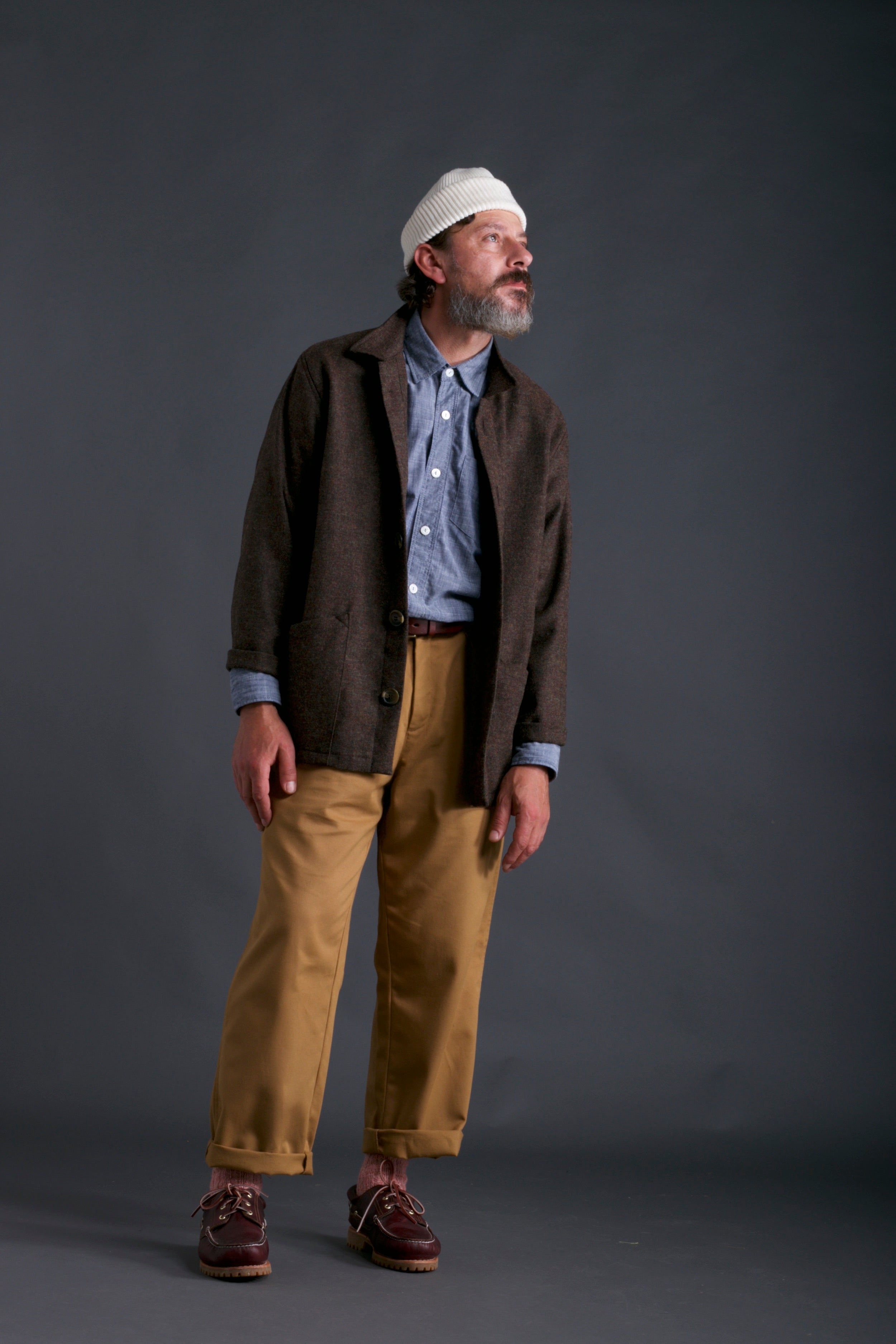 Man wears Carrier Company Irish Wool Jacket with Chambray Shirt, Classic Trouser and Wool Hat in Ecru