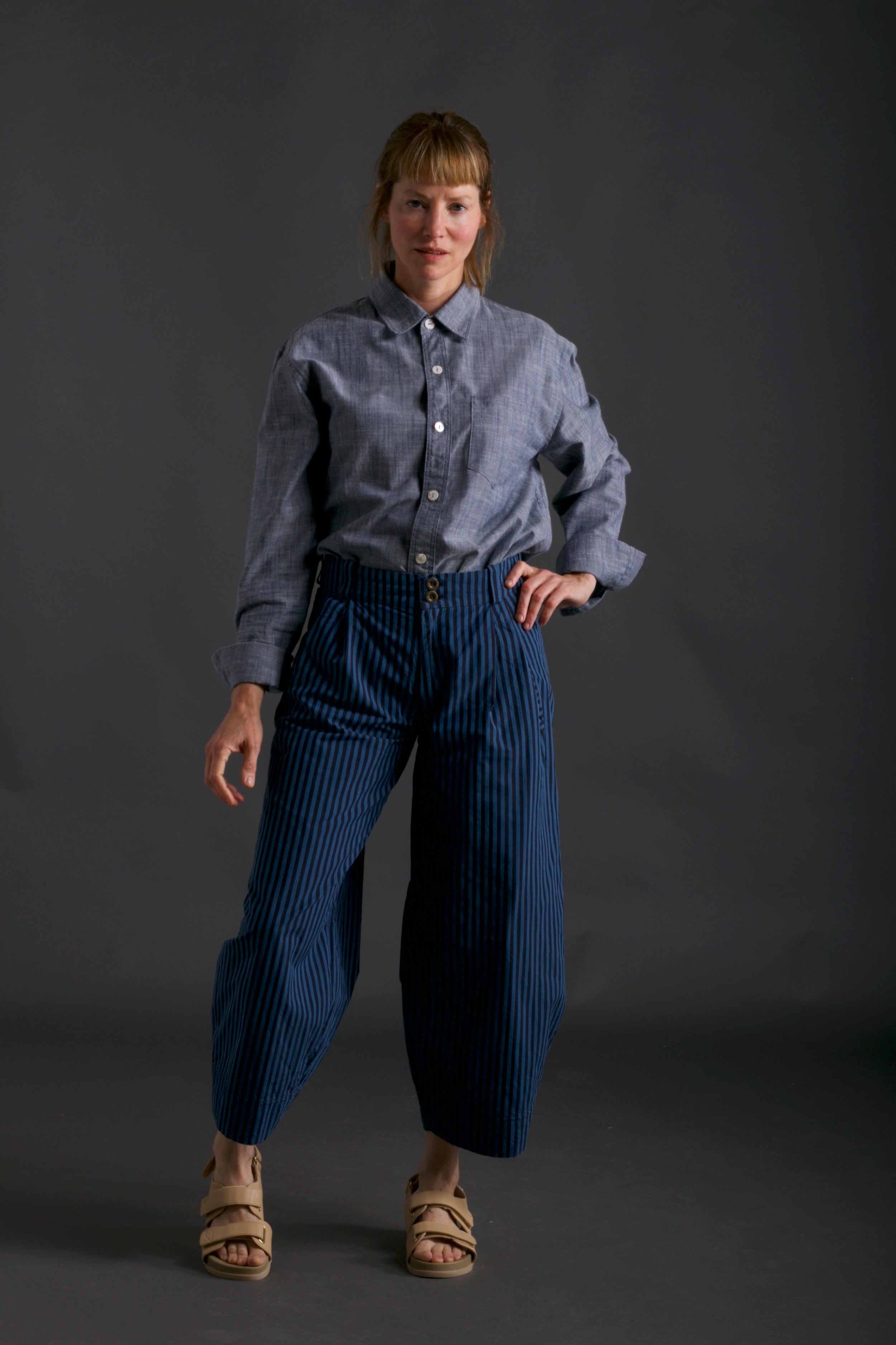 Sienna wears Striped Dutch Trouser with Chambray Shirt