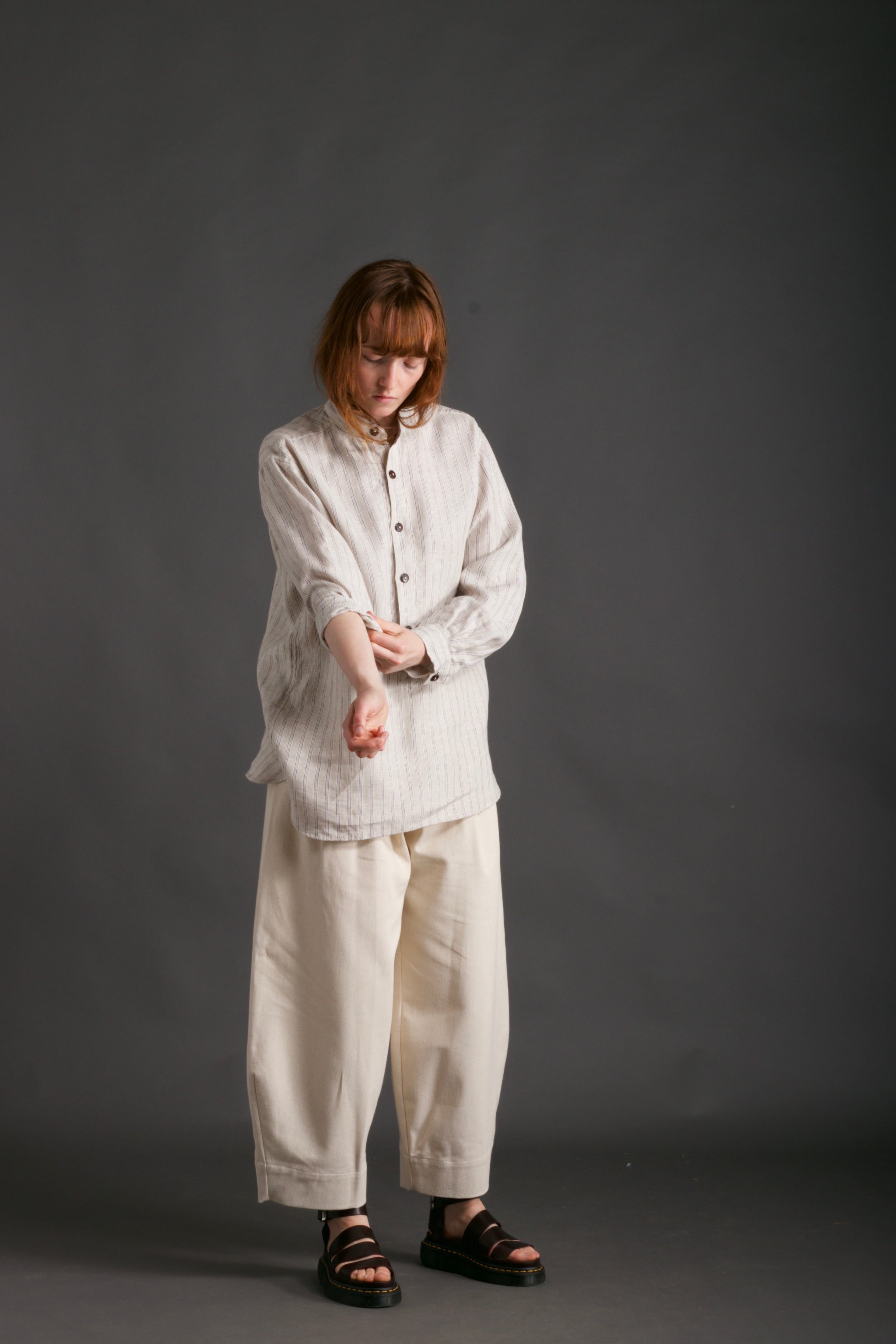 Woman wears Carrier Company Collarless Work Shirt in Linen with Dutch Trouser in Seeded Denim