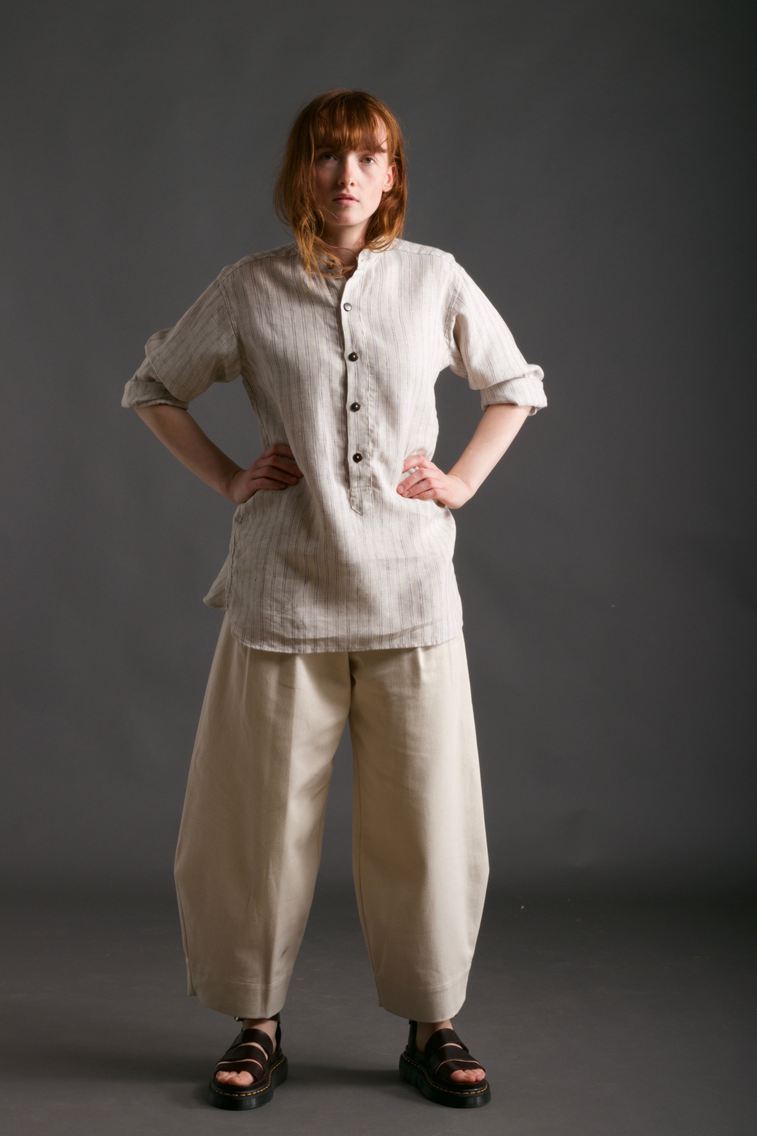 Woman wears Carrier Company Collarless Work Shirt in Linen with Dutch Trouser in Seeded Denim
