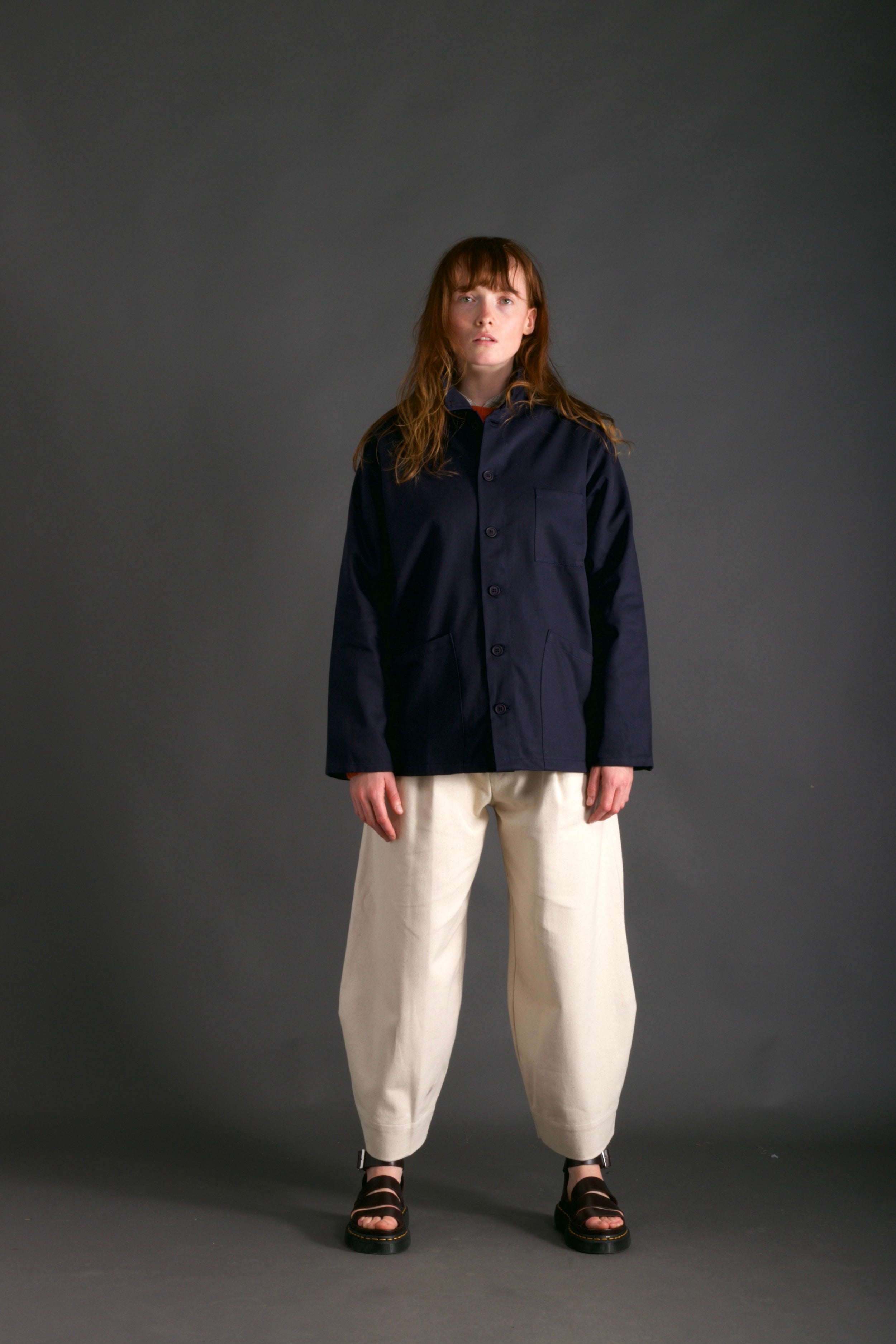 Woman wearing Carrier Company Traditional Norfolk Work Jacket in Navy and  Dutch Trouser in Seeded Denim