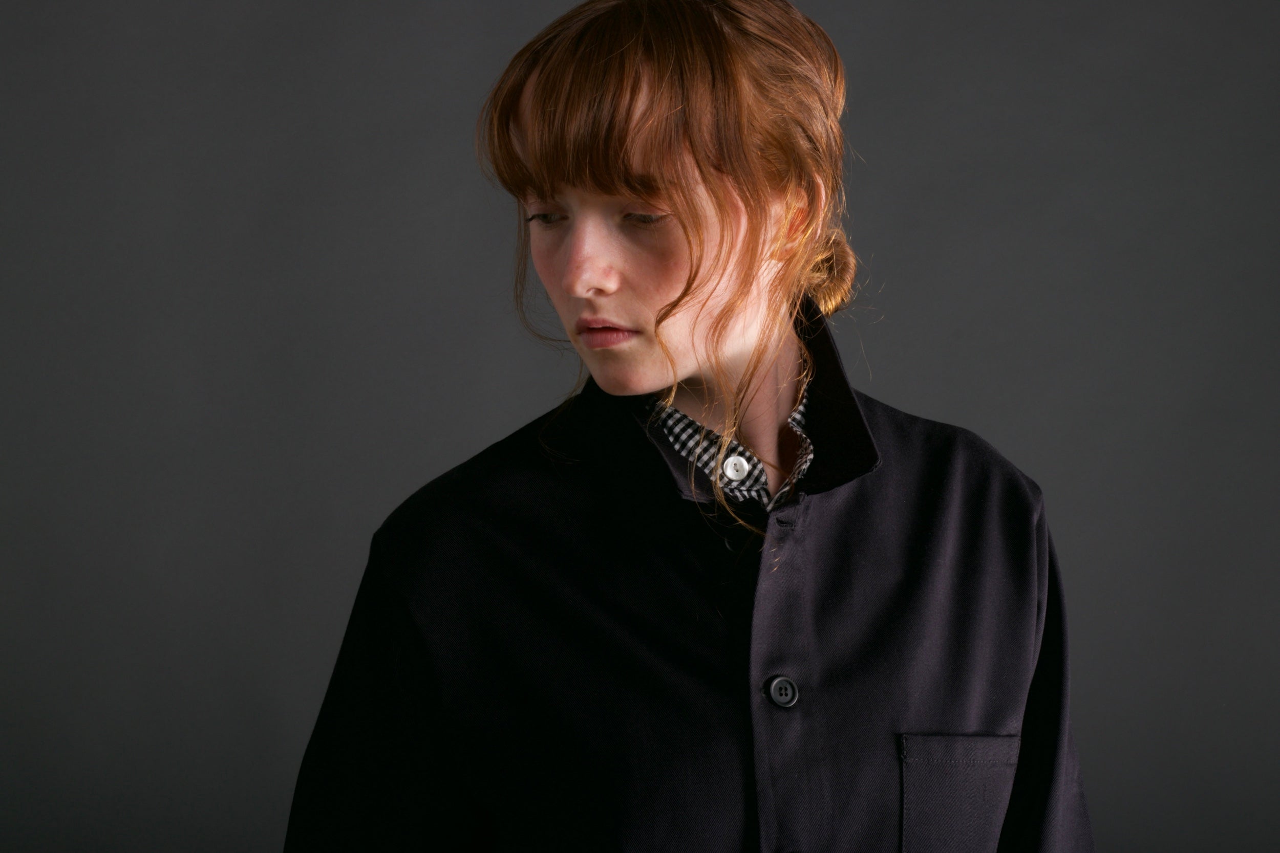 Woman wears Carrier Company Norfolk Work jacket in Black with Women's Dungarees and Organic Cotton Collarless Shirt in Black Gingham