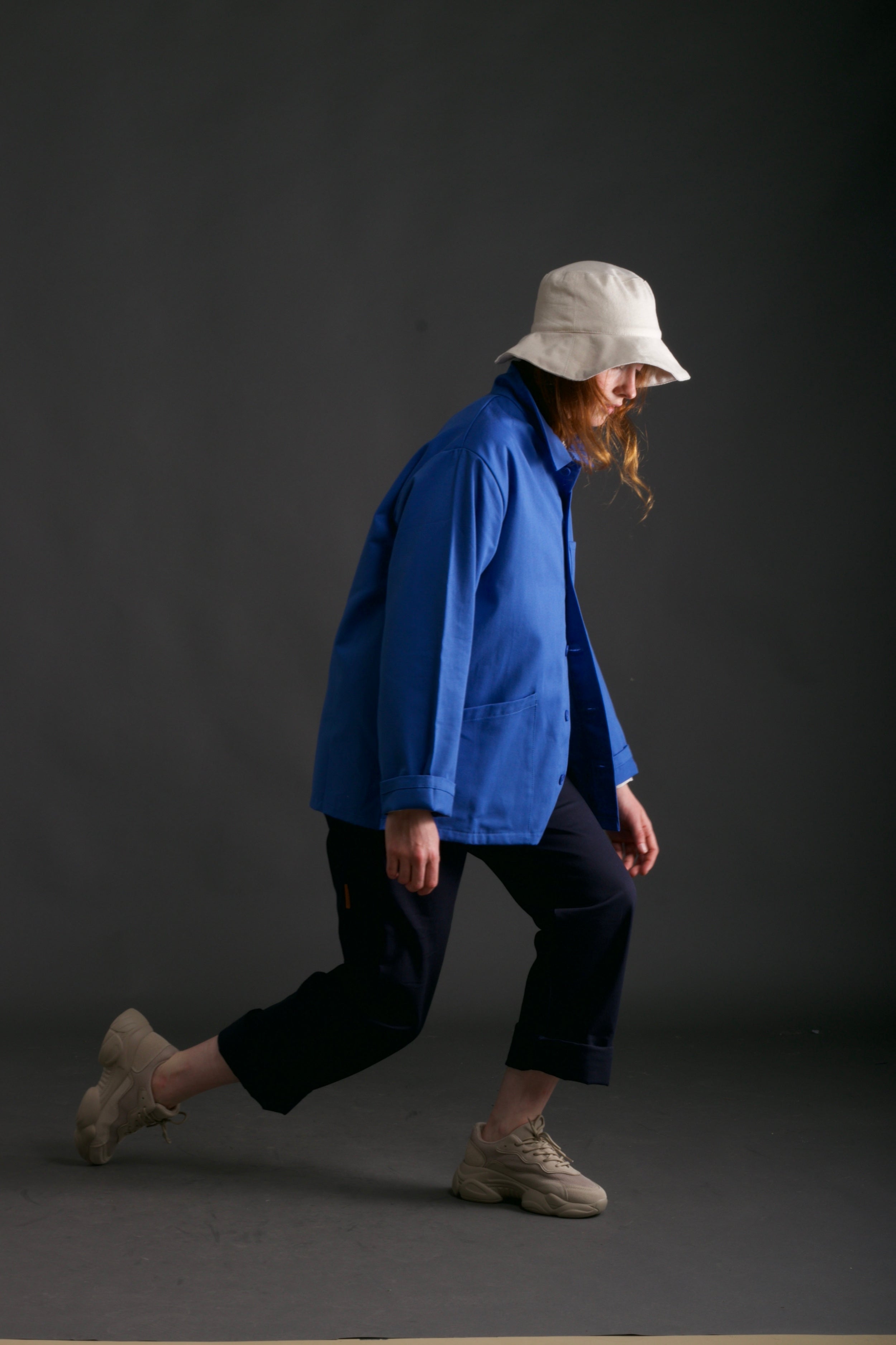 Woman wears Carrier Company Traditional Work Jacket in Sky Blue