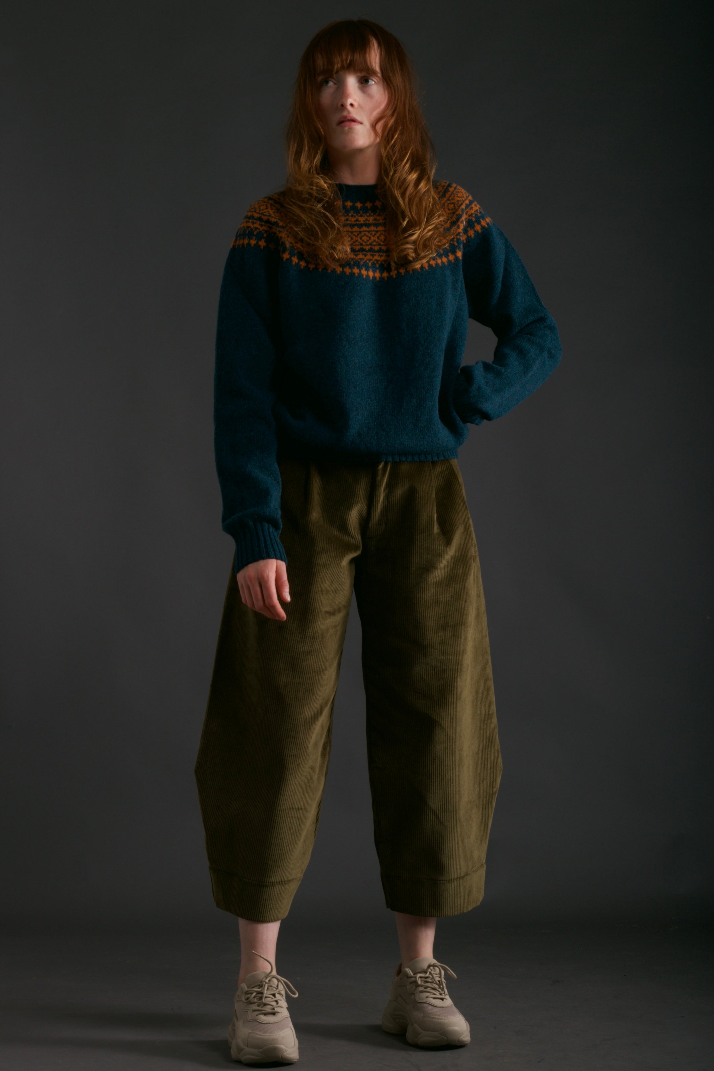 Woman wears Carrier Company Dutch Trouser in Corduroy with Yoke Shetland Lambswool Jumper