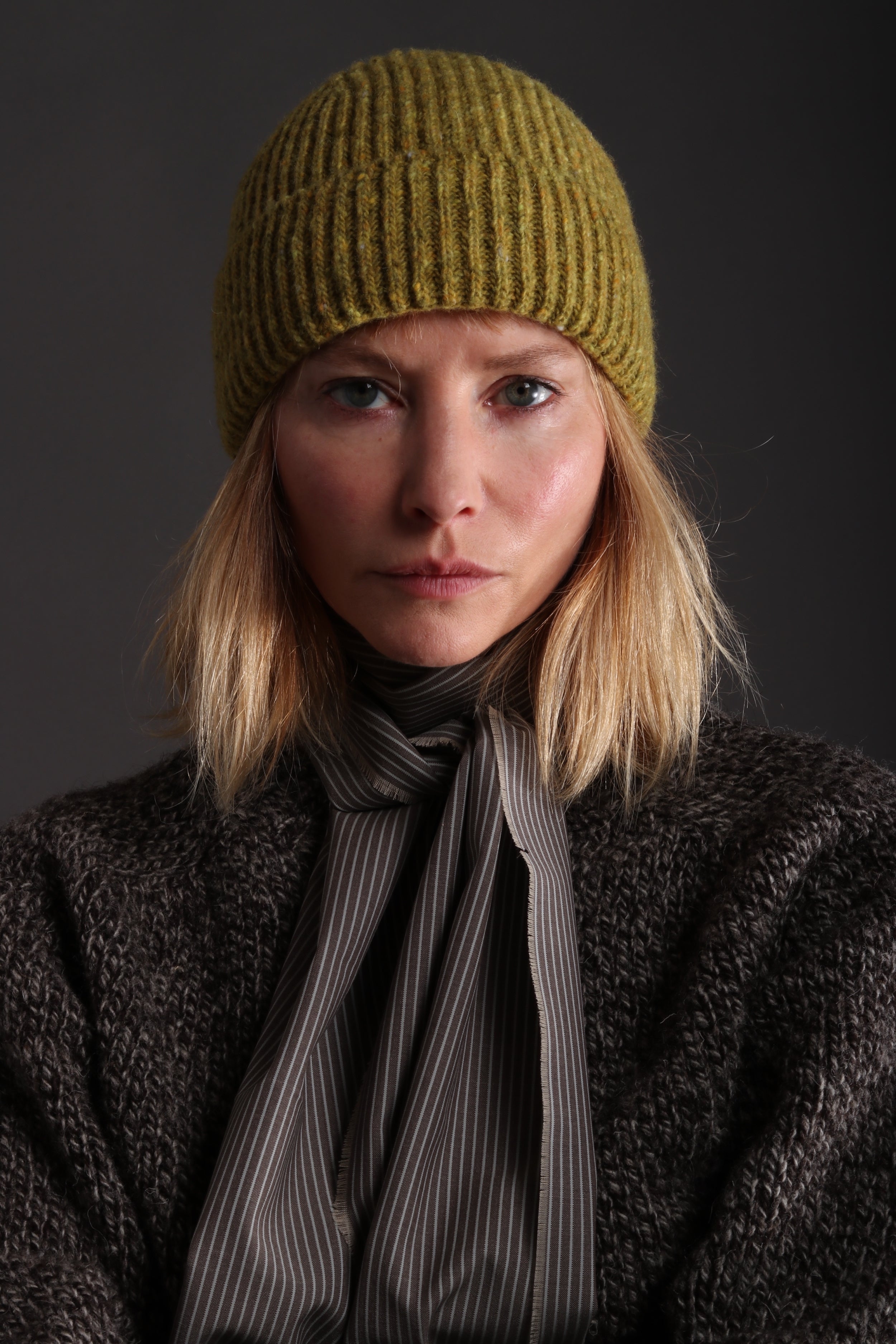 Woman wears wears Carrier Company Donegal Wool Hat in Pistacchio with Heavy Heritage Lambswool Jumper